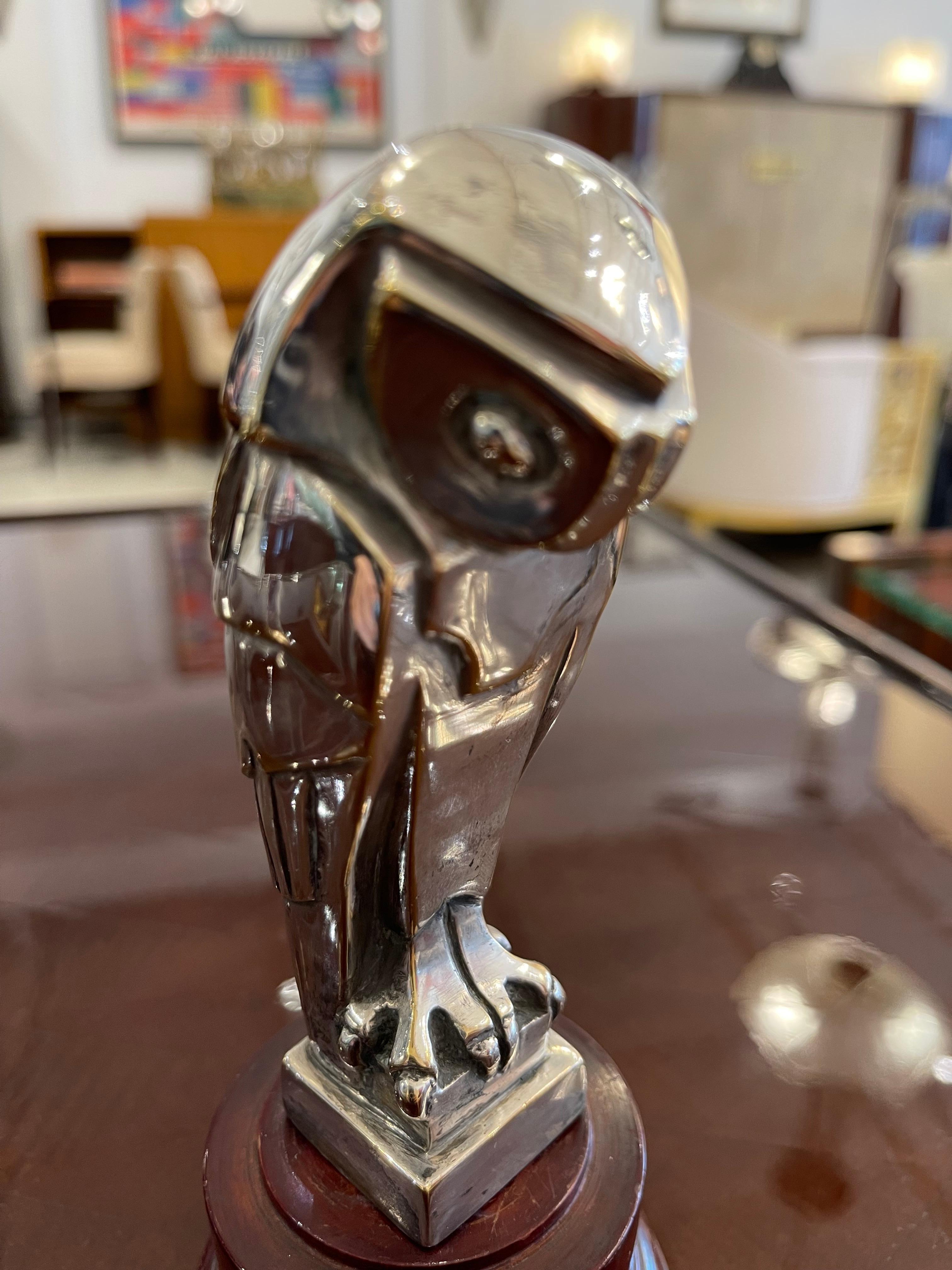 Art Deco Silver-Plated Bronze Car Mascot designed by E. Sandoz depicting an owl on a wood base.
Made in France 
Circa: 1930
Signature: Ed M. Sandoz.