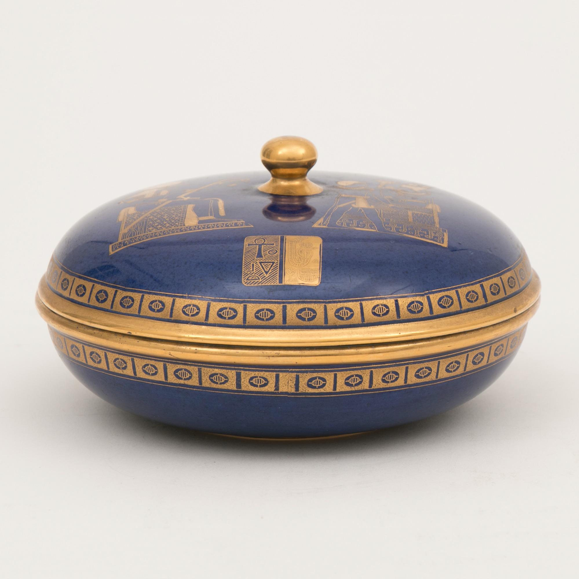 Art Deco Carltonware covered bowl designed by Enoch Boulton, with the Tutankhamun design 22-carat gilt decoration.
Measures: H 10cm, W 18cm, D 18cm
British, circa 1925

Carlton ware created this design to celebrate the opening of Tutankhamun's