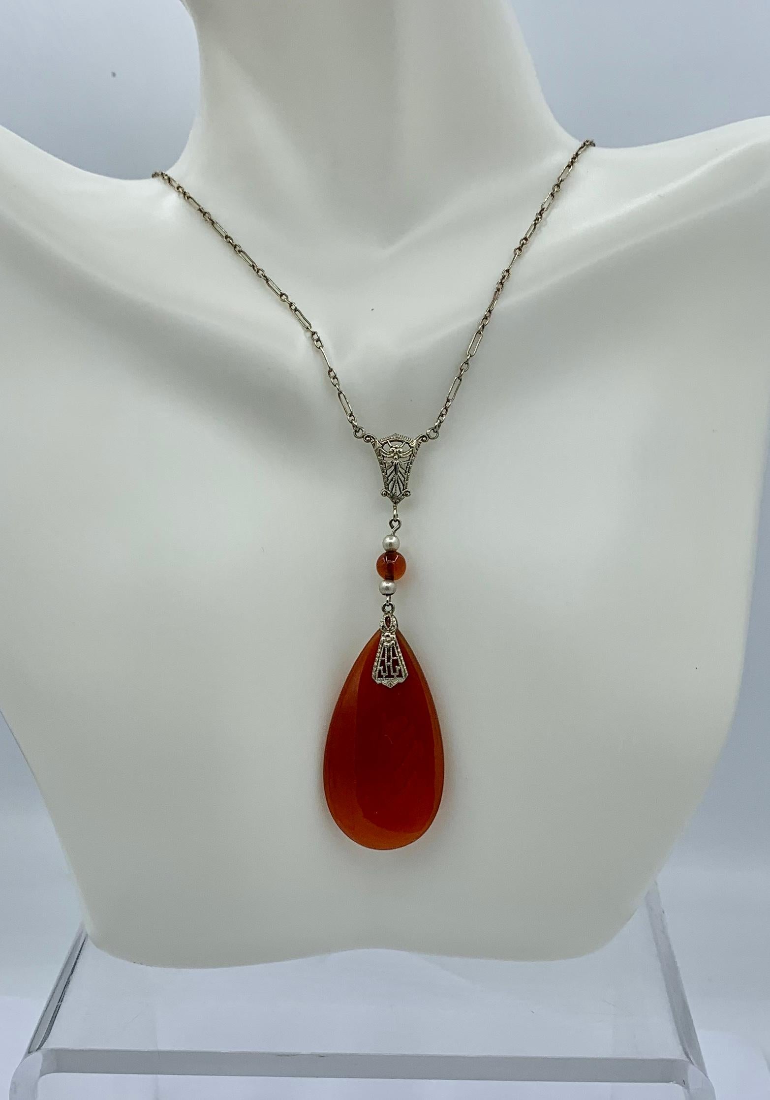 THIS IS AN EXTRAORDINARY ANTIQUE ART DECO JEWEL FROM A MAGNIFICENT NEW YORK ESTATE.  THE DRAMATIC NECKLACE IS OF NATURAL MINED CARNELIAN WITH A STUNNING CARNELIAN PENDANT AND PEARL AND CARNELIAN DROP WITH A FILIGREE DESIGN AND WONDERFUL CHAIN IN 14