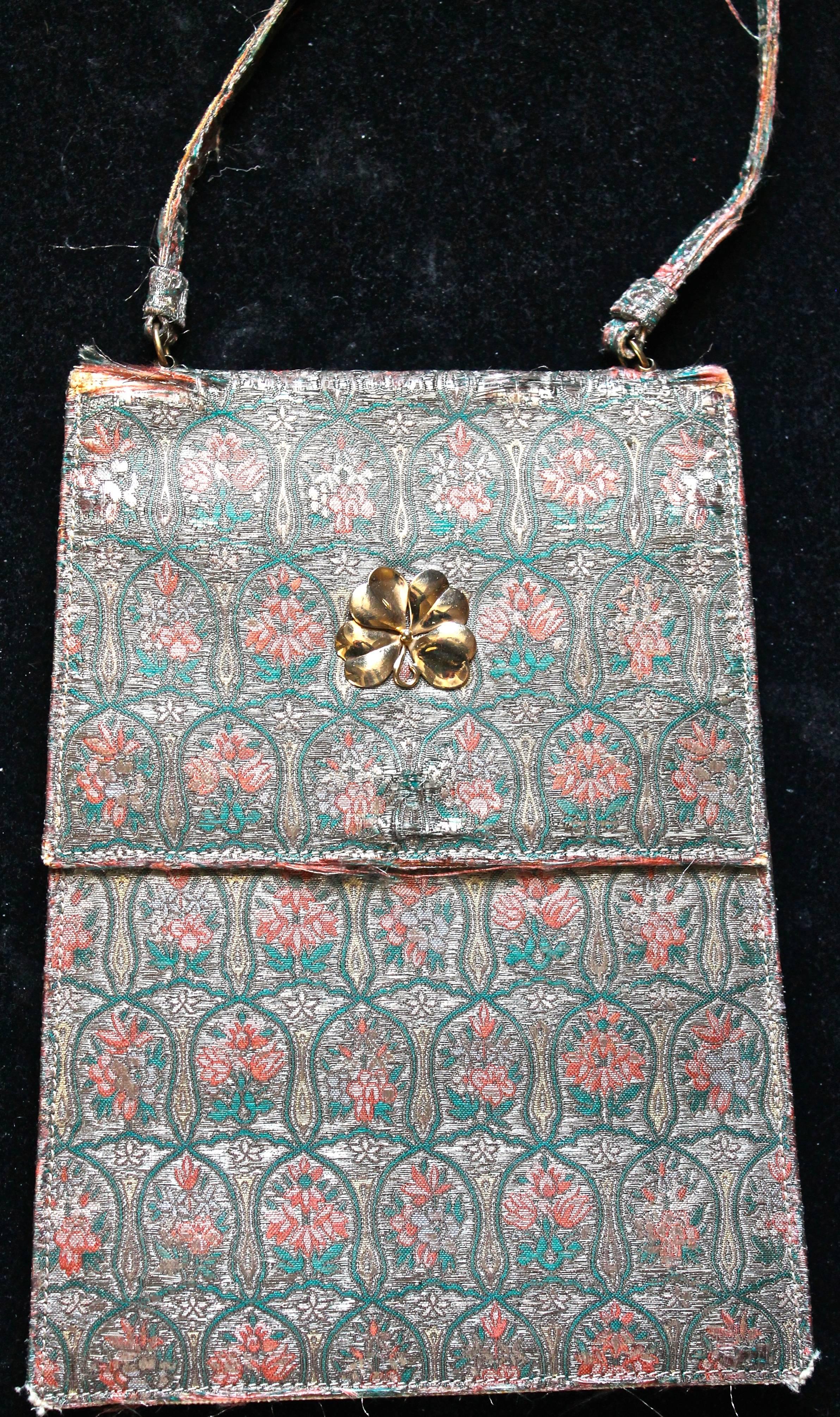 Cartier Art Deco evening bag. Silk with gold thread, gold clasp (untested). Silk interior with gilt monogram J.W.T. and signed Cartier.