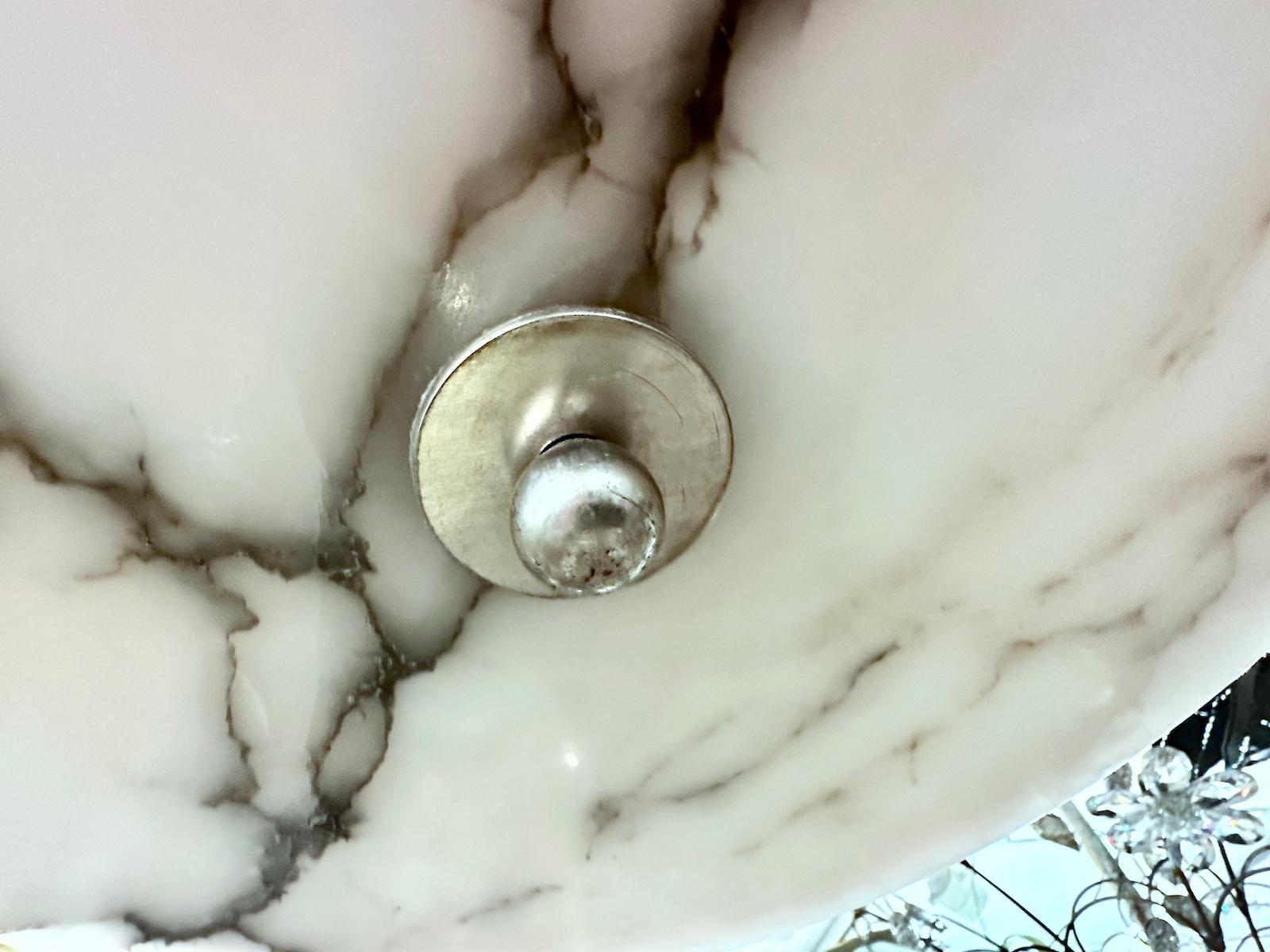 A circa 1930's Italian carved alabaster light fixture with stepped design, with interior lights and silver-plated hardware.

Measurements
Diameter: 19.5