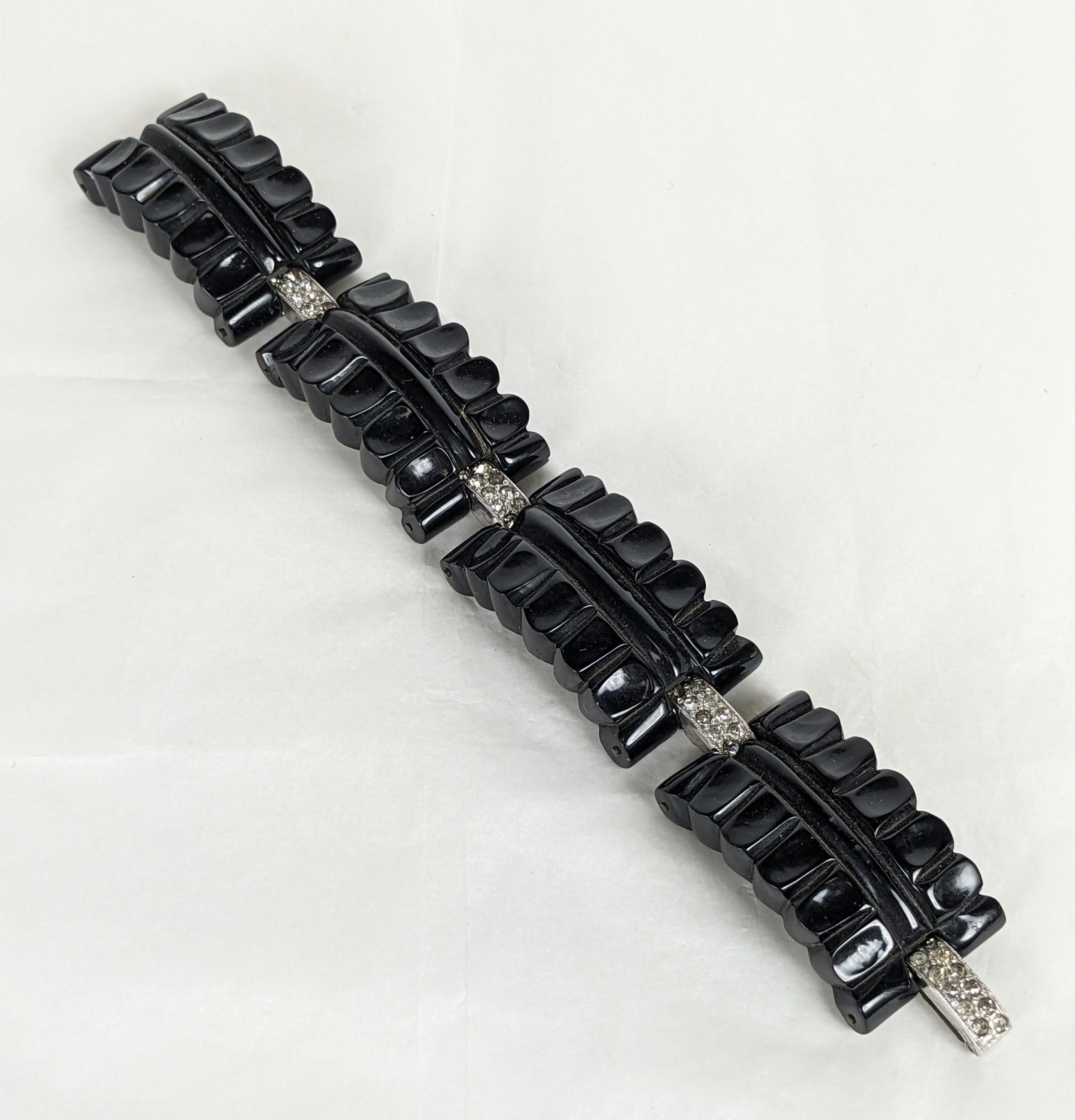 Striking Art Deco Carved Bakelite and Pave Link Bracelet from the 1930's. Hand carved black bakelite links with pave crystal links and clasp. High Art Deco Style. 7.5