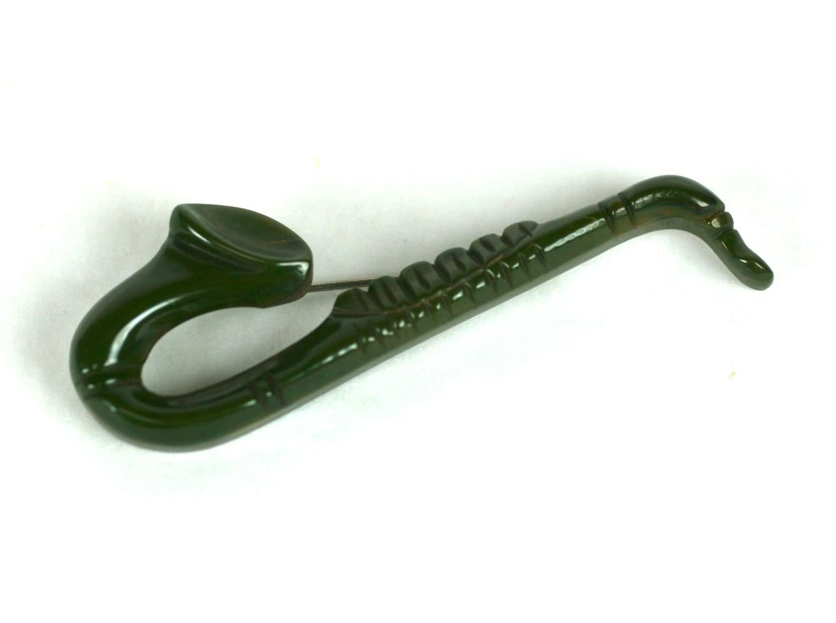 Women's or Men's Art Deco Carved Bakelite Saxophone Brooch For Sale