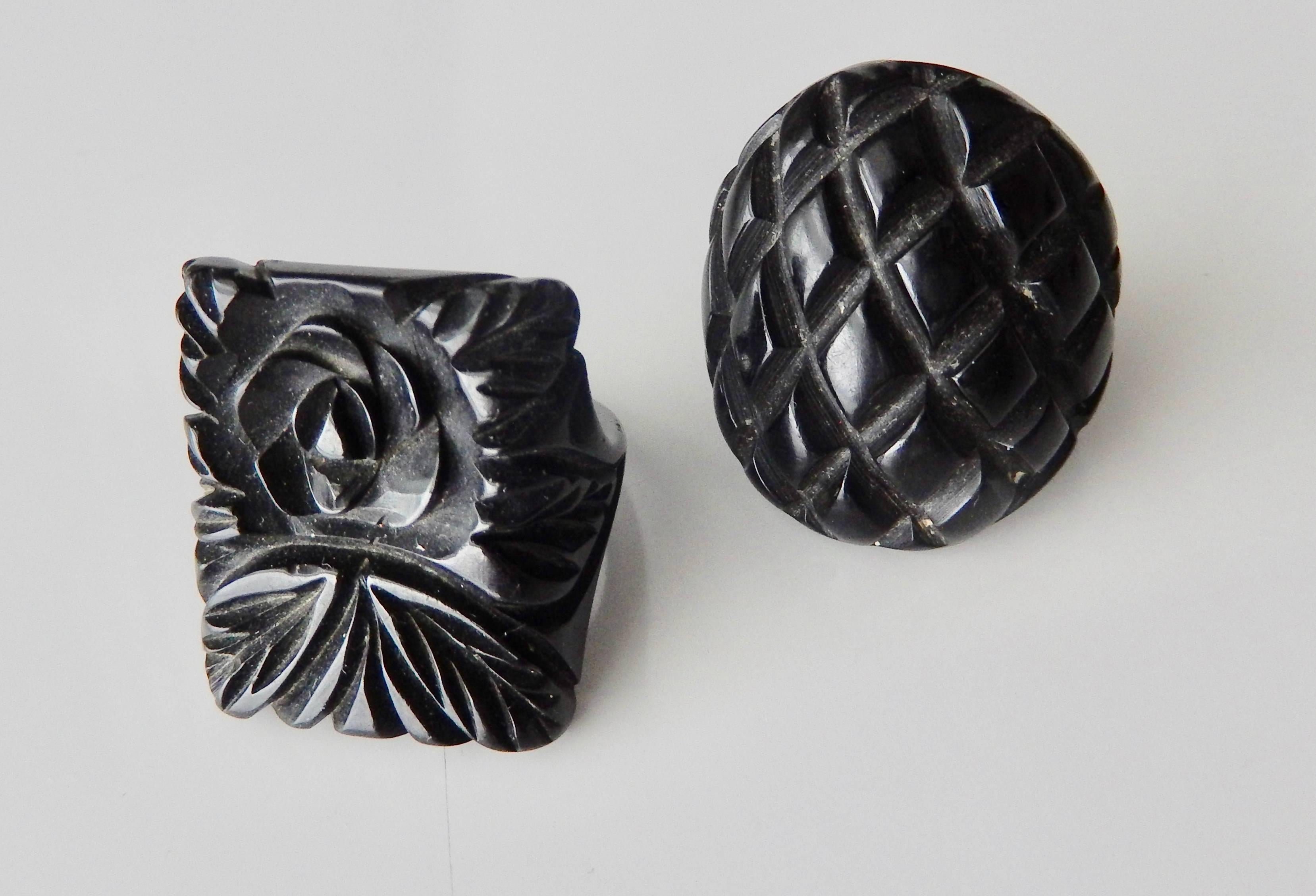 Two beautifully-detailed, carved black bakelite rings.  Both rings are a very comfortable fit and were created in the  popular bakelite color--black.  Price is for two rings.

Sizes:
Oval:  6
Rectangular:  6 1/2