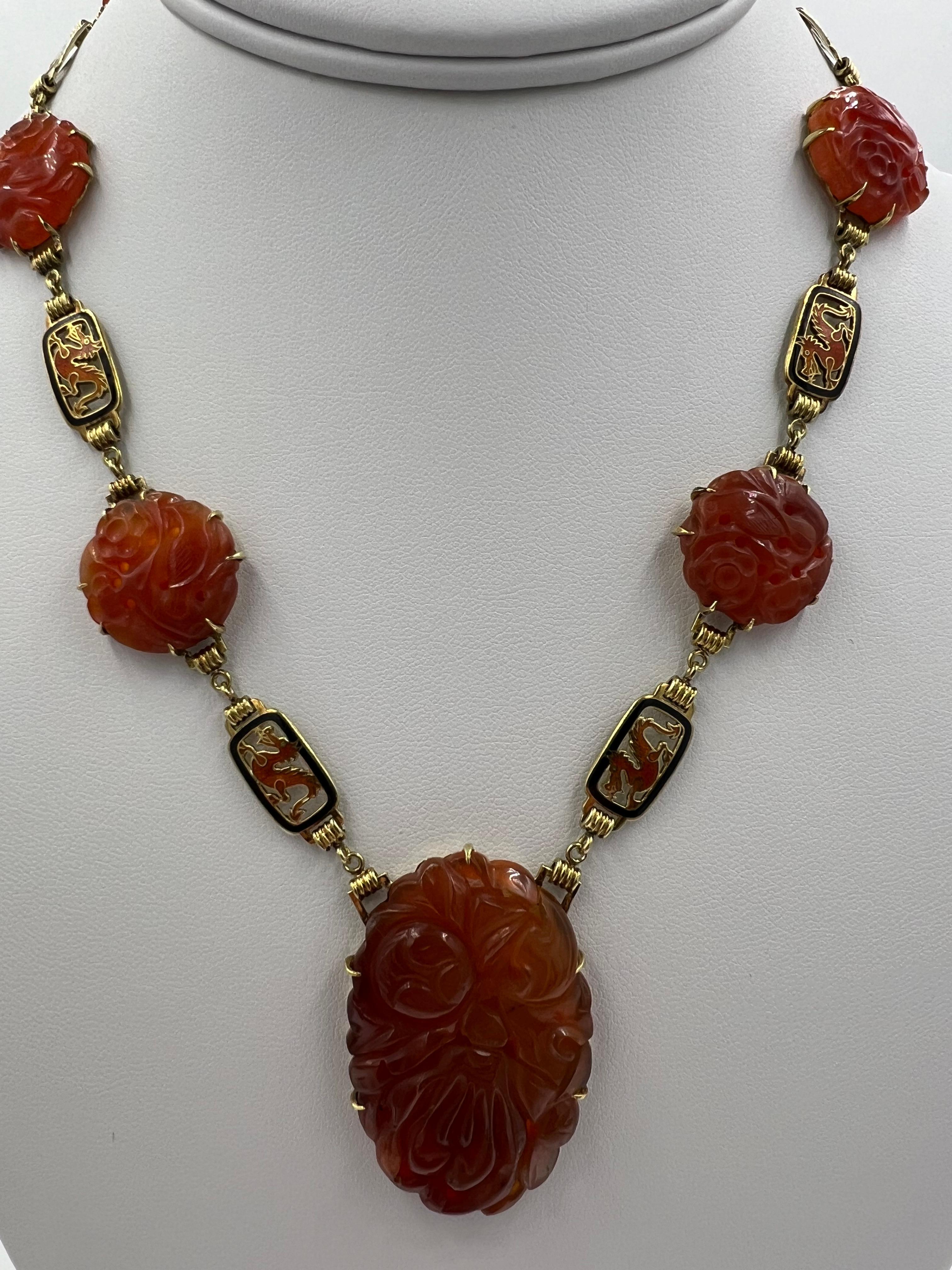 Art Deco Carved Carnelian enamel dragon yellow gold necklace, circa 1925.

The Art Deco era, spanning from the 1920s to the 1930s, is characterized by its distinctive style that merges decorative arts with modernist sensibilities. A quintessential