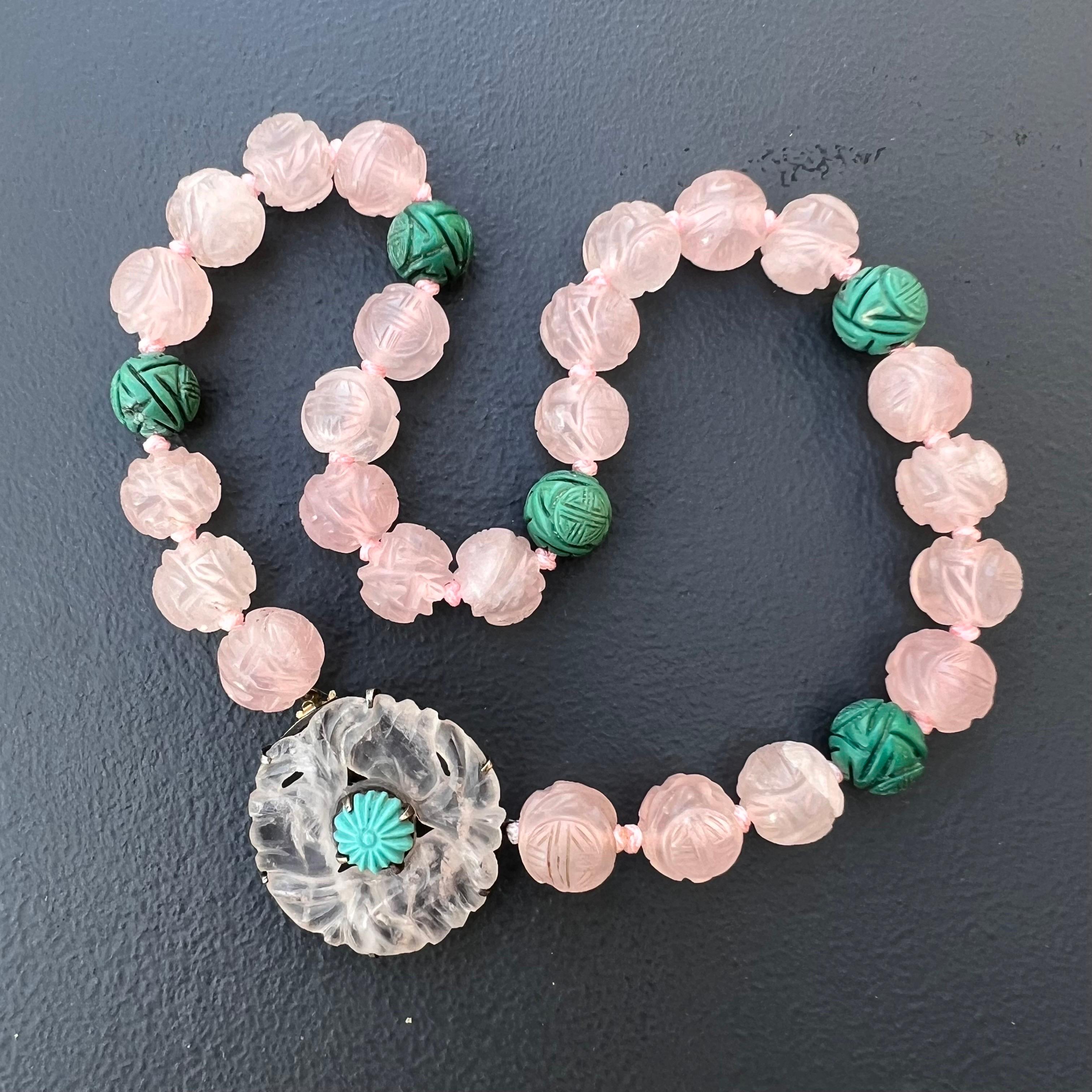 Art Deco Chinese export hand carved rose quartz and turquoise pendant beaded   necklace  . Beads are hand carved with Shou  mark . Central pendant features a pierced rose quartz disc which is set on an sterling silver frame , pendant acts as a clasp