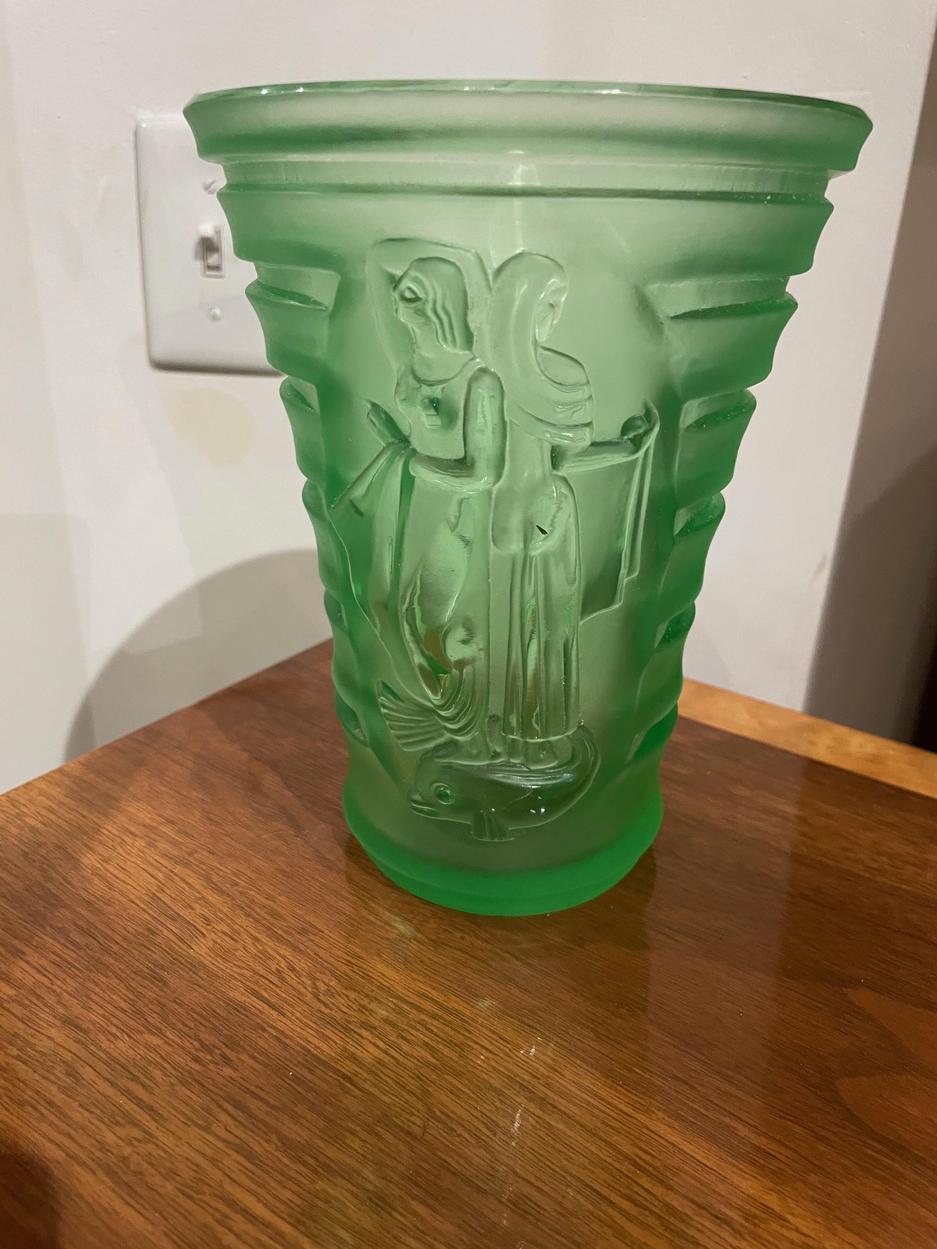 Art Deco carved green glass vase with Woman & Birds. A rare and unique vase with deep carving shows stylized art deco women and birds. The lovely heavy vase would be great with flowers or a display. It is unsigned but most likely from a great Czech