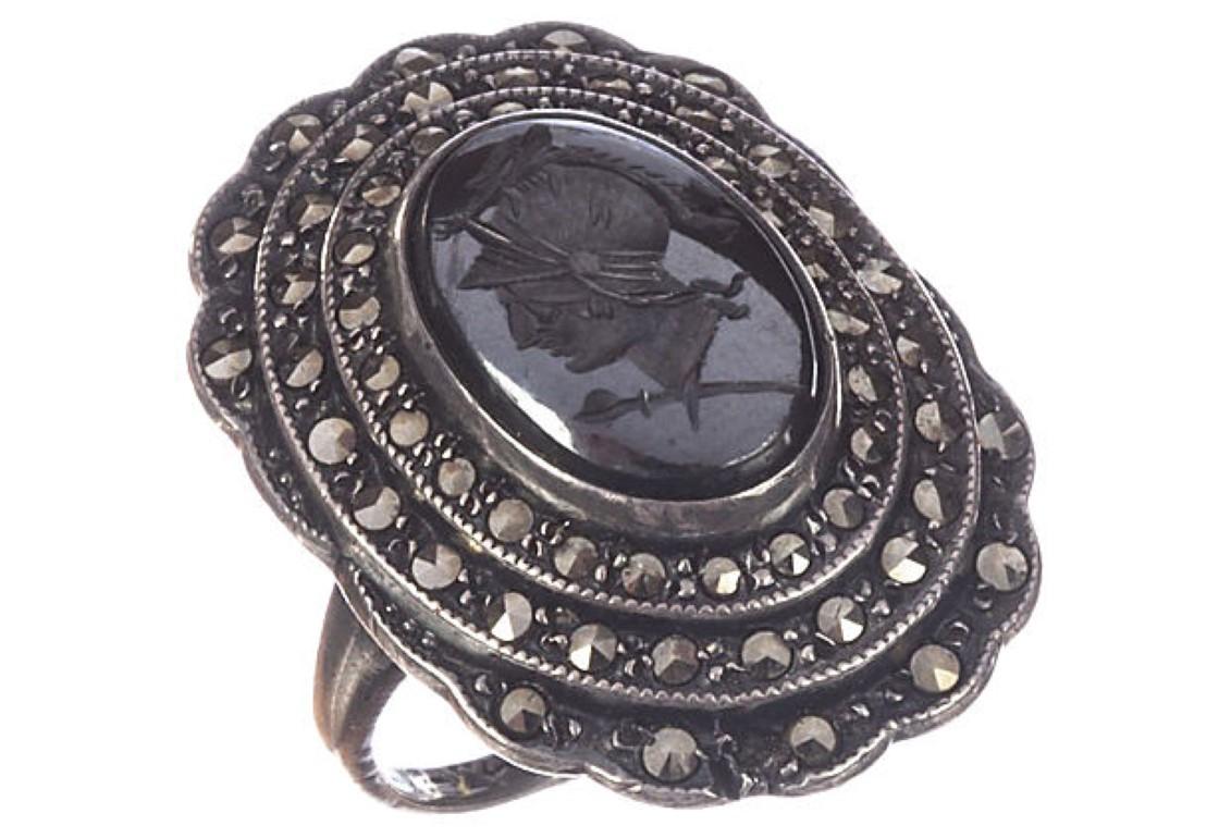 1930s Art Deco hand-carved hematite Perseus intaglio ring accented with marcasites. Intaglio, 13 mm x 9 mm. Ring size: 5.
