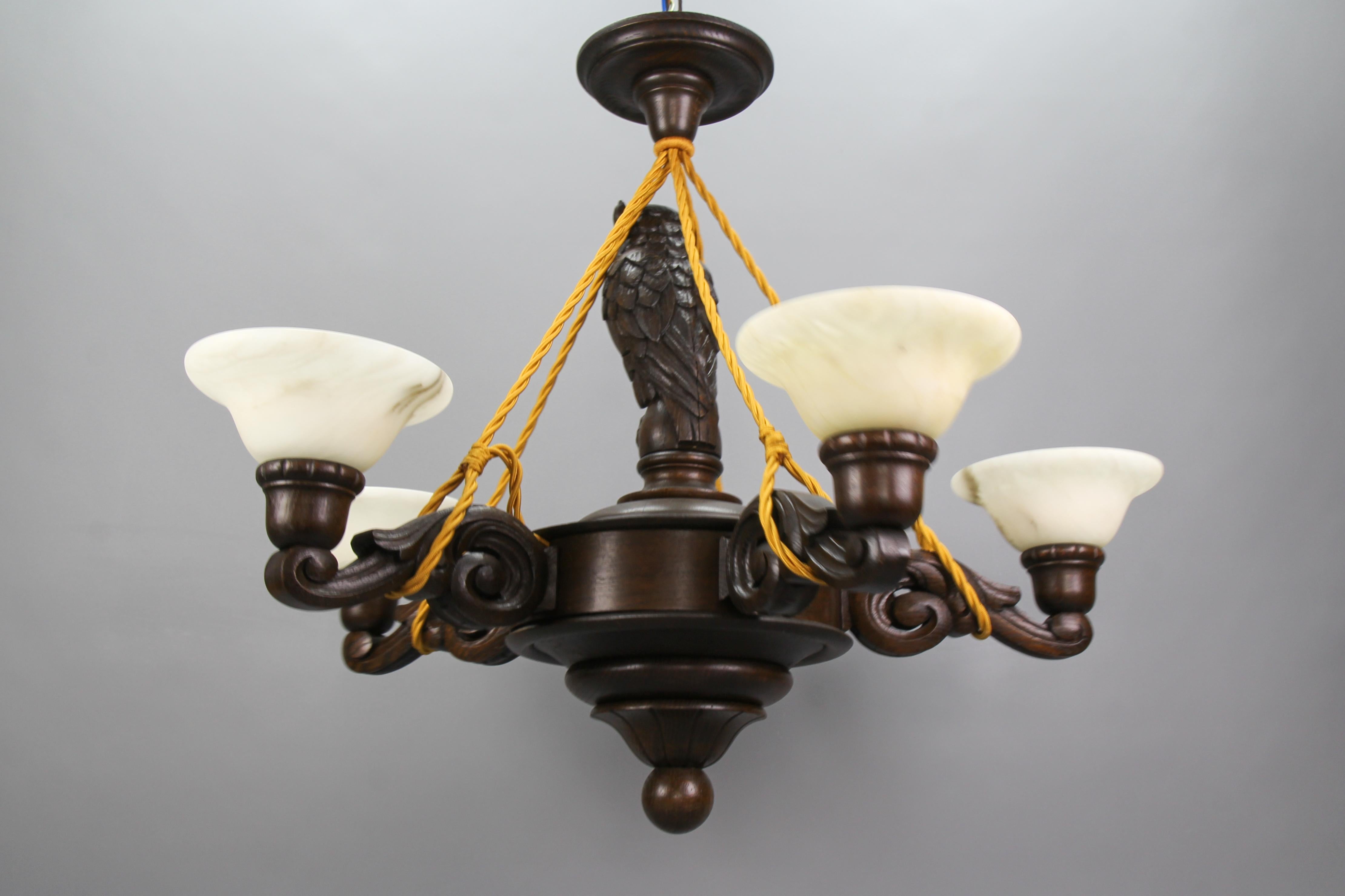Mid-20th Century Art Deco Carved Oakwood and Alabaster Five-Light Chandelier with Owl Figure For Sale