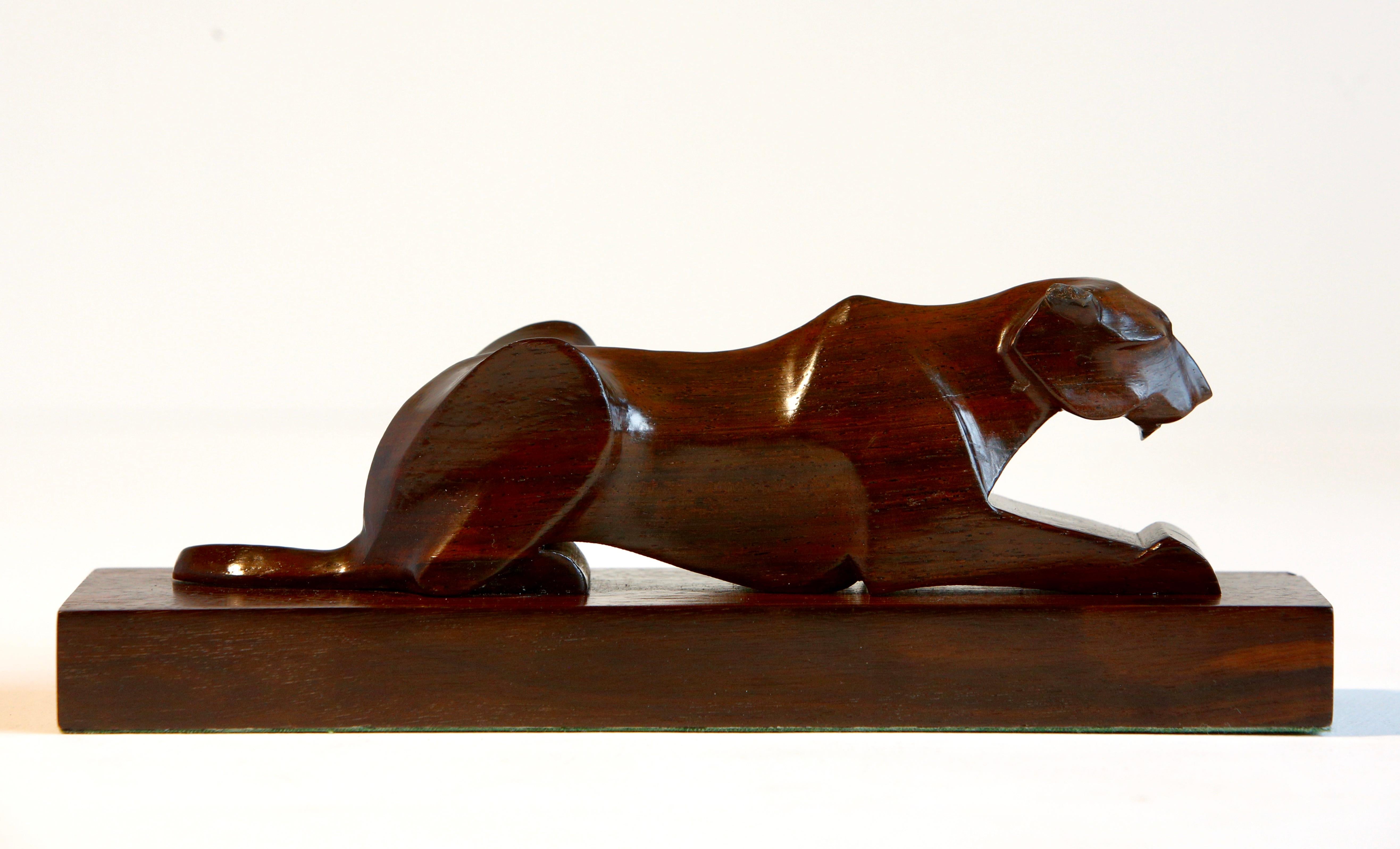 Carved Panther French Art Deco Sculpture

A fine French Art Deco carved panther in macassar wood on matching plinth. 

Slight rubbing /.nibbles to the ears but otherwise excellent condition   