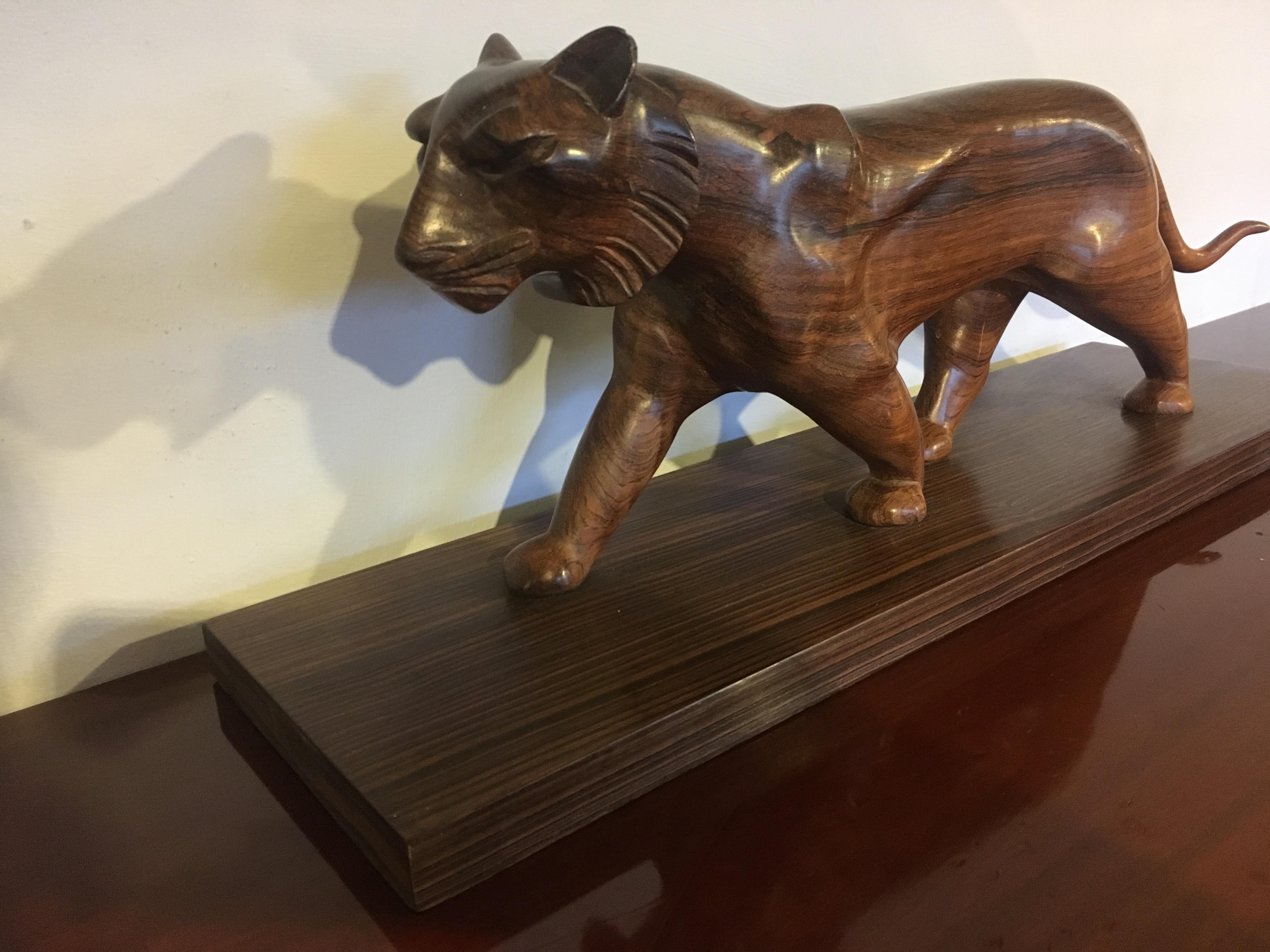 Very stylish carved walnut sculpture of a panther mounted on a base veneered with Macassar Ebony 

Dating to circa 1930s bearing the signature H Imre ? slightly indistinct. 

NB has had a small crack in the tail 

Measures: Height 8 inches