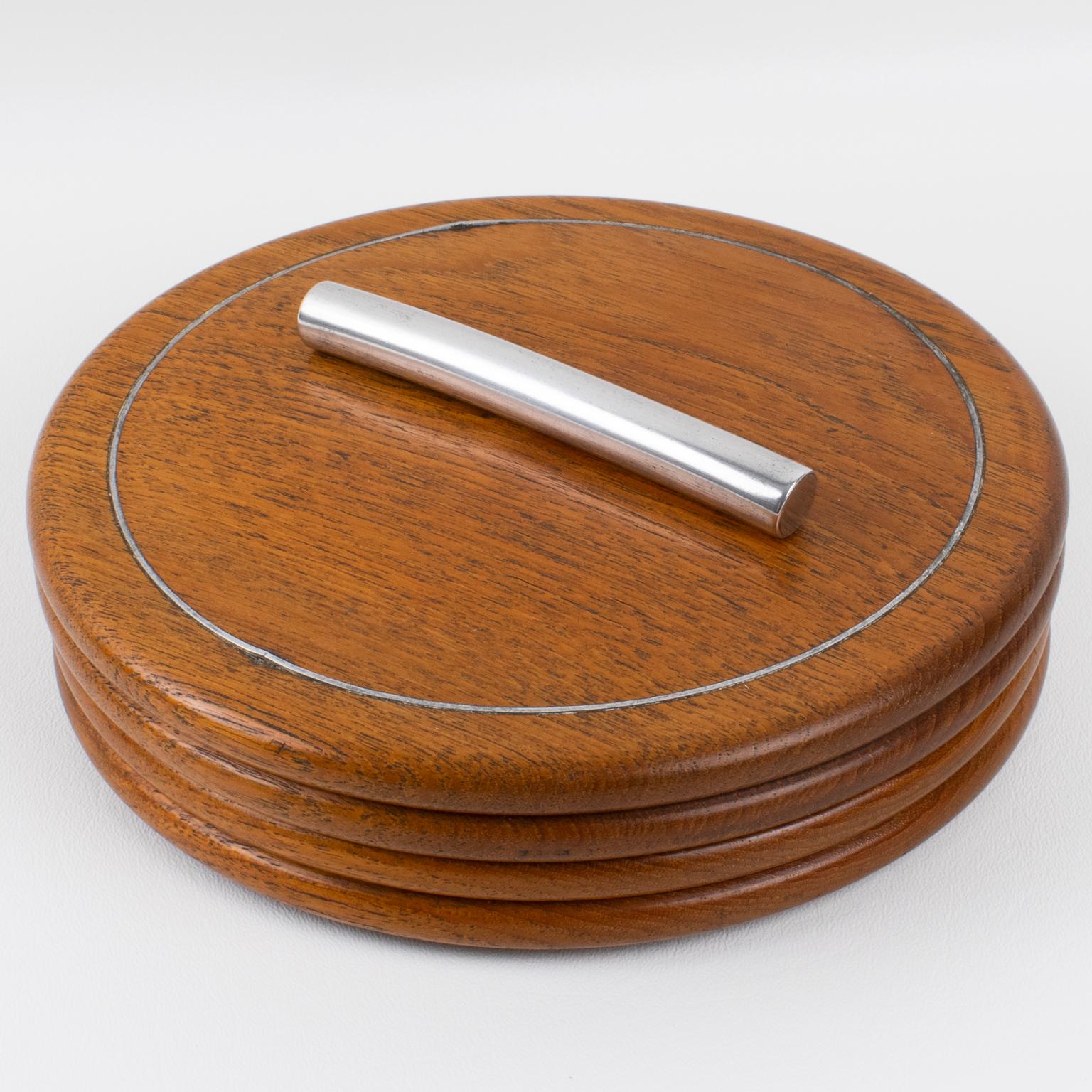 This wood box, expertly crafted in France circa 1930, will make a statement in any room. The box features a unique and eye-catching design, with a beautiful oak wood grain complemented by bright chrome metal accents, creating a timeless piece. This
