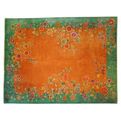 Art deco: Cascade of flowers on bright orange field and emerald green border