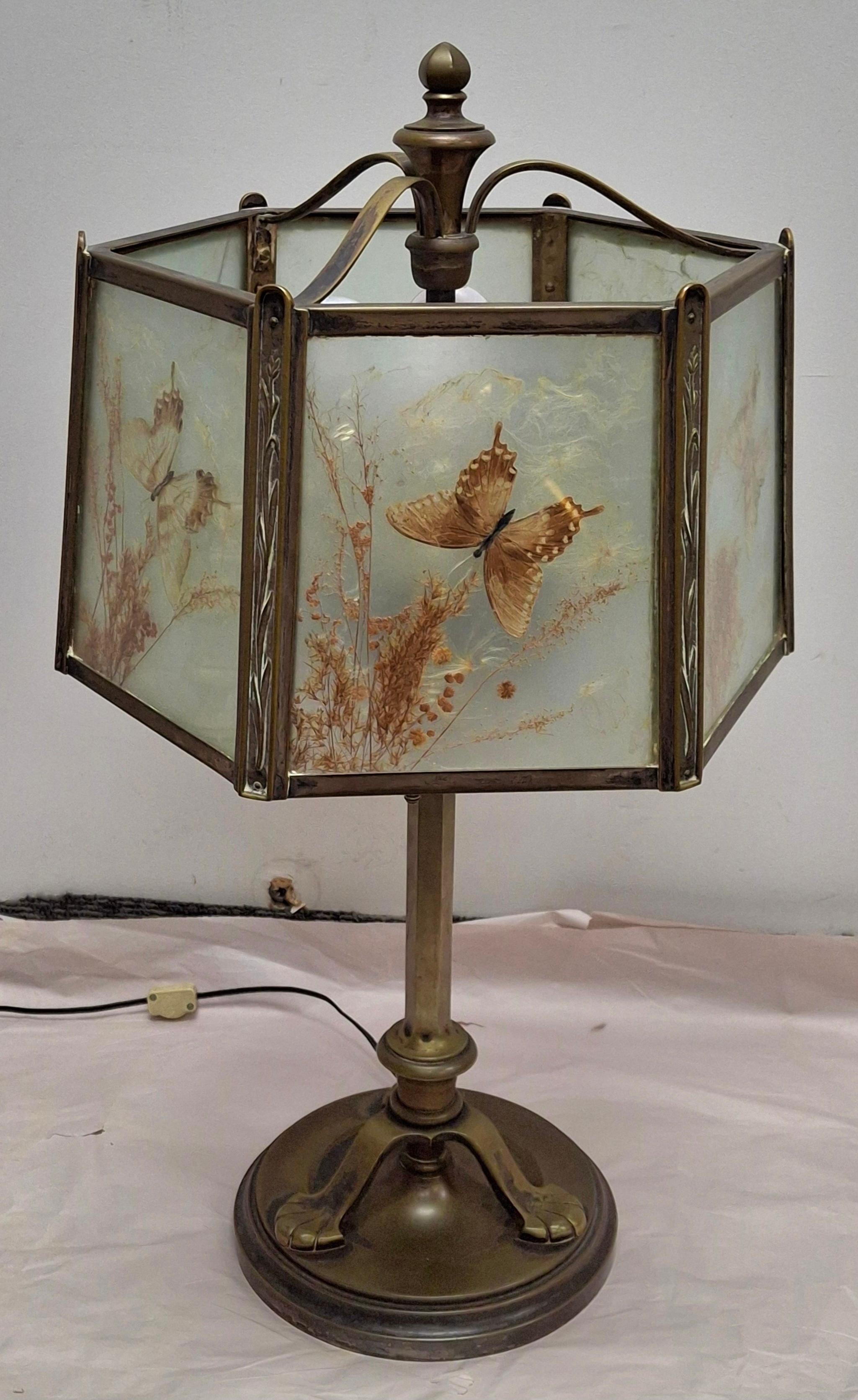 A rare Antique Art Deco Bronze four-Socket Table Lamp with Glass Taxidermy Butterfly Lamp Shade. This table is made out of cast bronze, very heavy , approximately 25 pounds. All Sockets independently operational with pull chain.
We don't see any