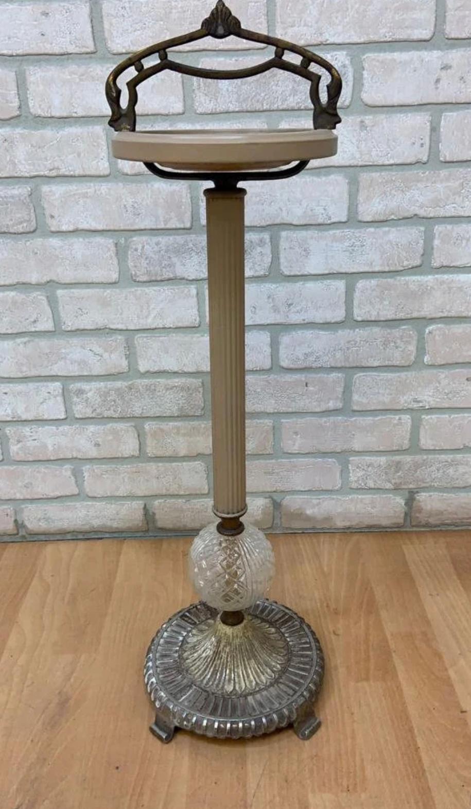 Art Deco Cast Iron and Crystal Cigar Ashtray Floor Stand with Forged Iron Handle

Truly a beautiful ashtray will be a gorgeous addition to the art
deco, Hollywood Regency decor.

Circa 1940

Dimensions:
H 28.5