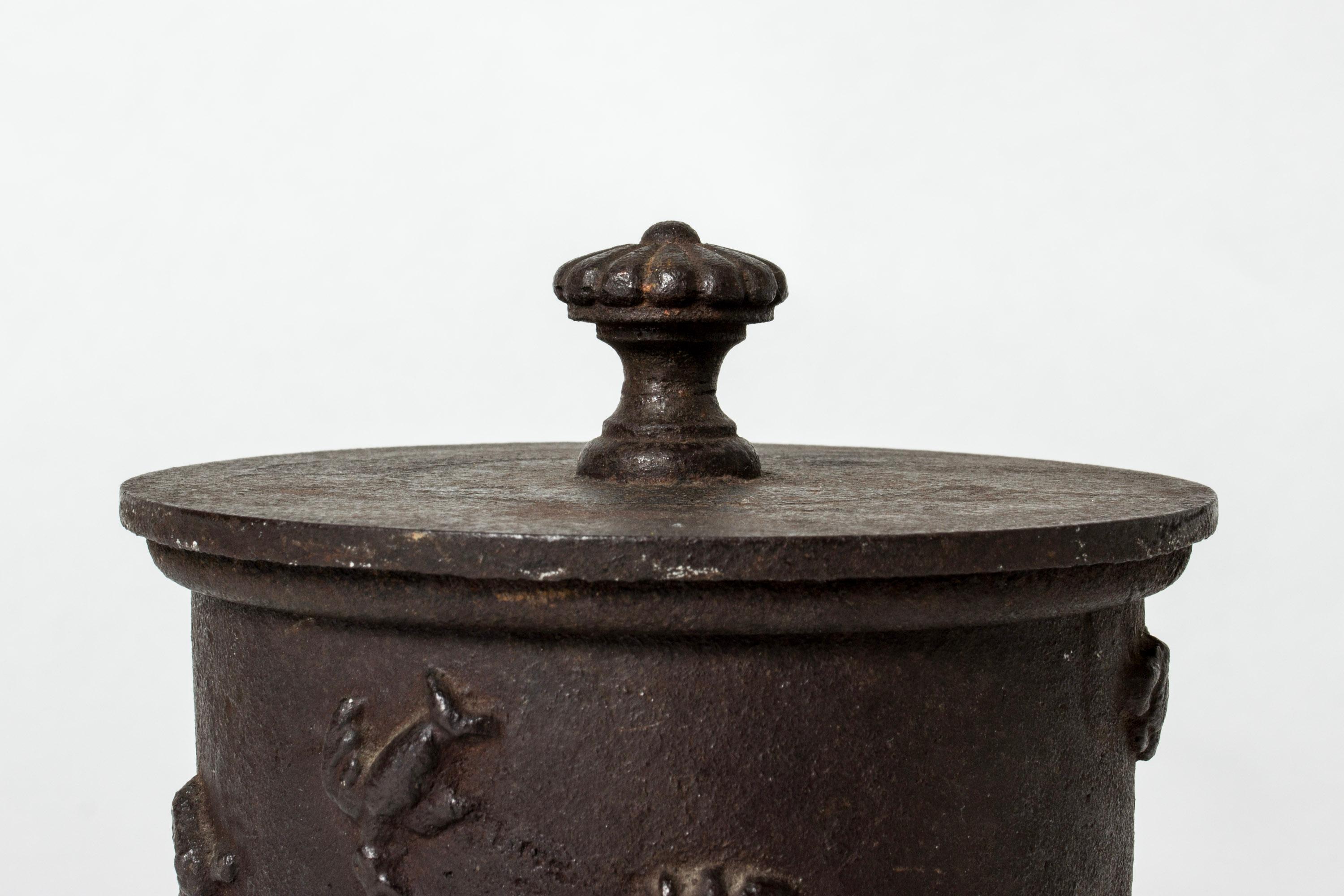 Elegant tobacco jar by Carl Elmberg, made in cast iron. Heavy quality. Relief decor of a running woman, a hunter and a deer.