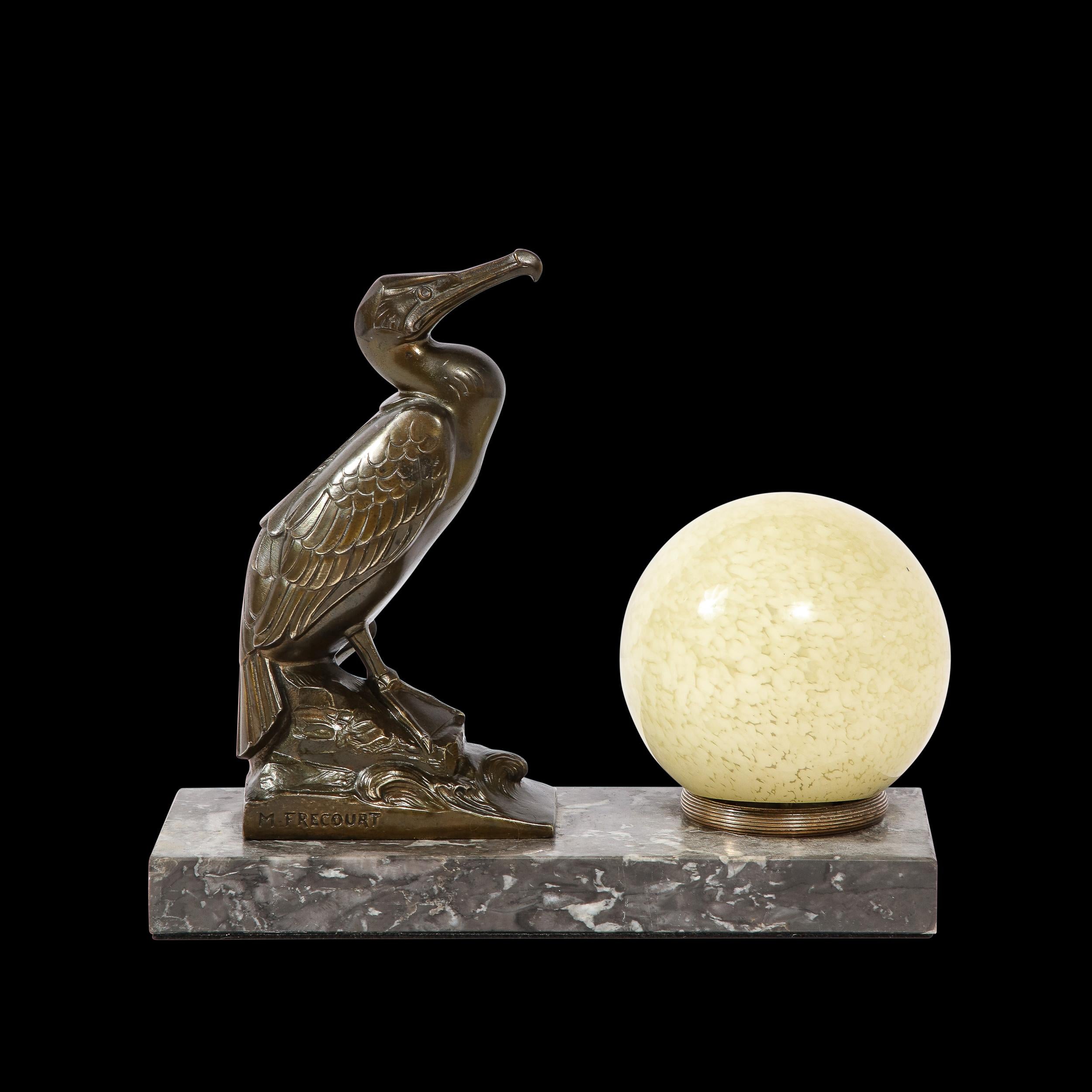 This unique and striking Art Deco Table Light in Caste Bronze with Marquina Marble Base and Hand-Blown Glass Shade is by the artist Maurice Frecourt, originating from France, Circa 1925. Featuring a stylized cormorant rendered in caste bronze