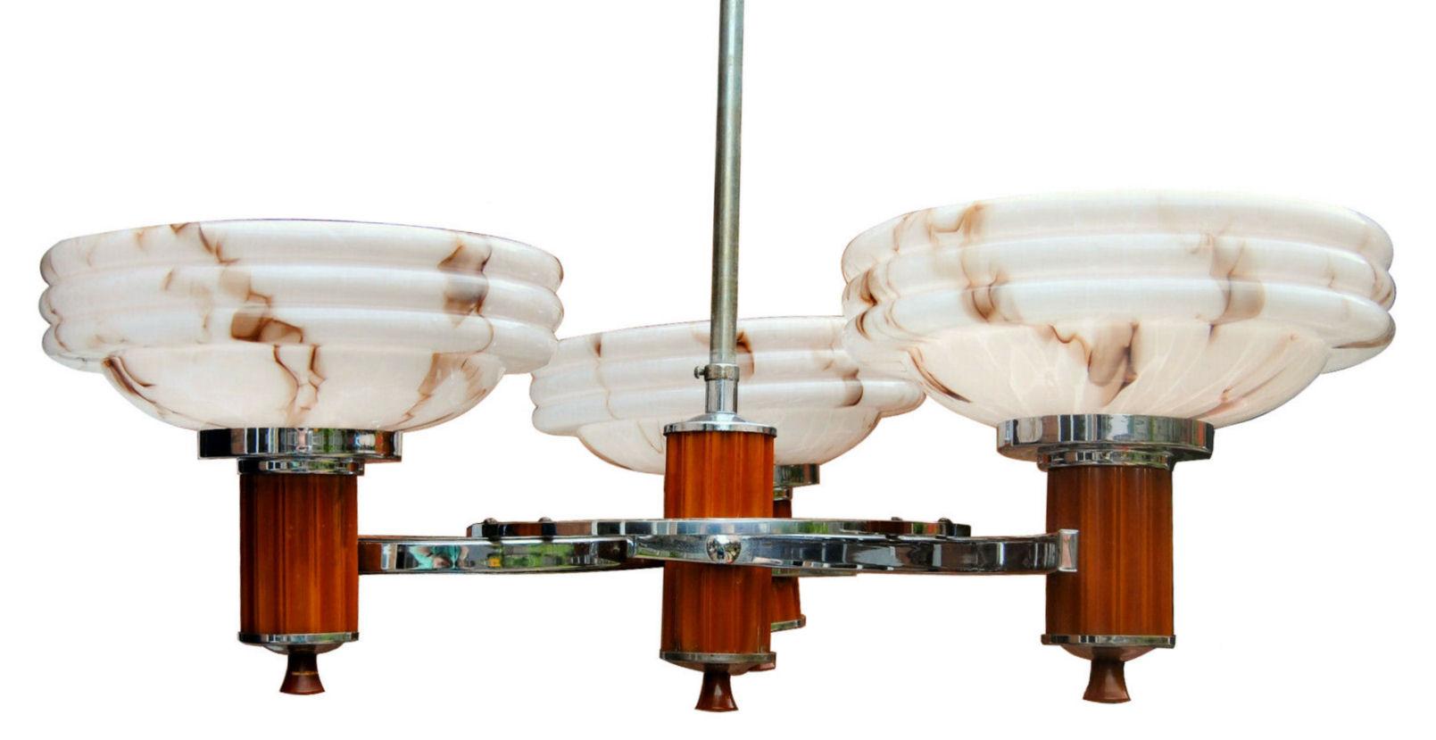 Beautiful and original 1930s Art Deco chrome and catalin (phenolic) bakelite three arm branch ceiling light with original toffee coloured swirled glass shades.
Still retains its original brown bakelite bulb holders. The beautiful glass shades are a