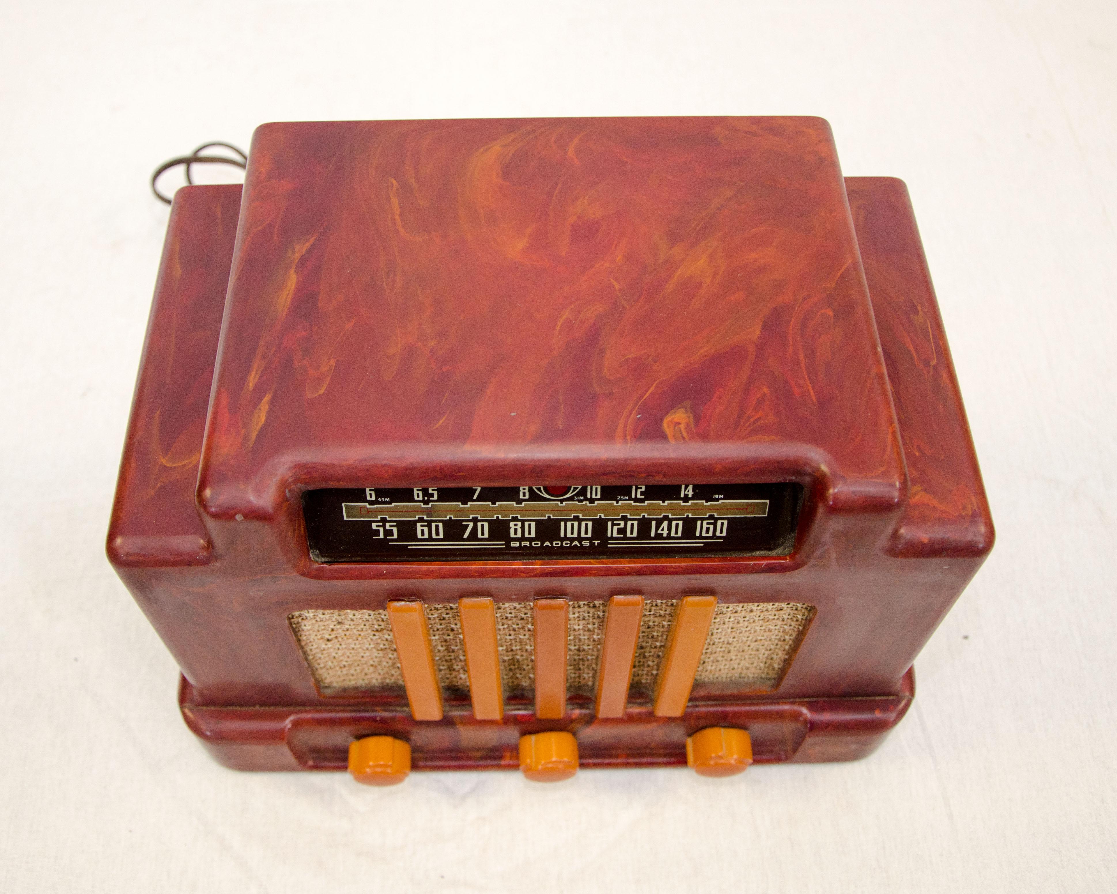 Beautiful vintage mottled red and butterscotch colored Catalin radio. It was manufactured by Addison Industries in Canada. Sometimes referred to as the 