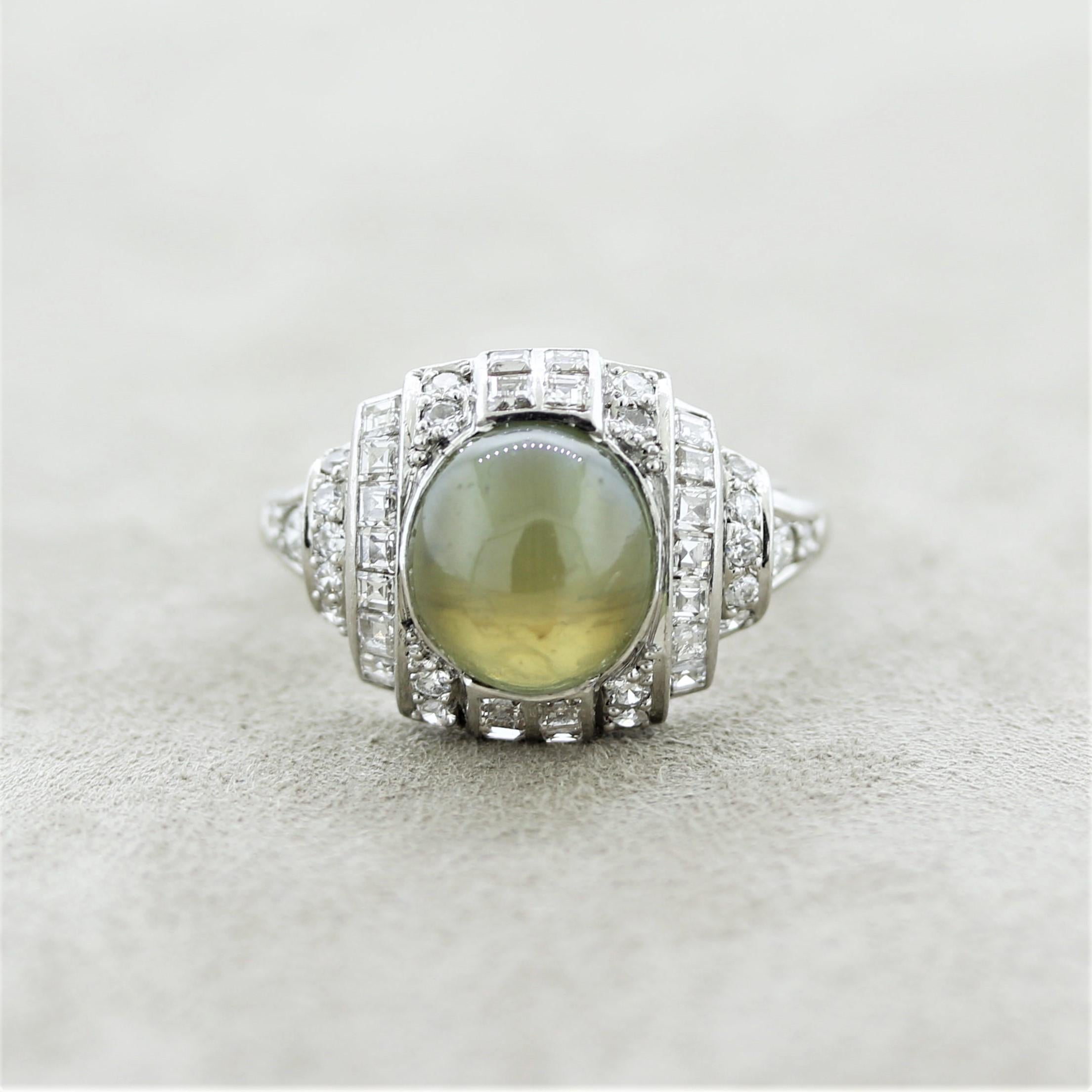 A treasure from the 1920’s Art Deco period featuring a 5.75 carat cats eye chrysoberyl. It has the ideal Milk & Honey color which is highly sought after as well as a strong and reflective cats eye. It is complemented by round and square shape