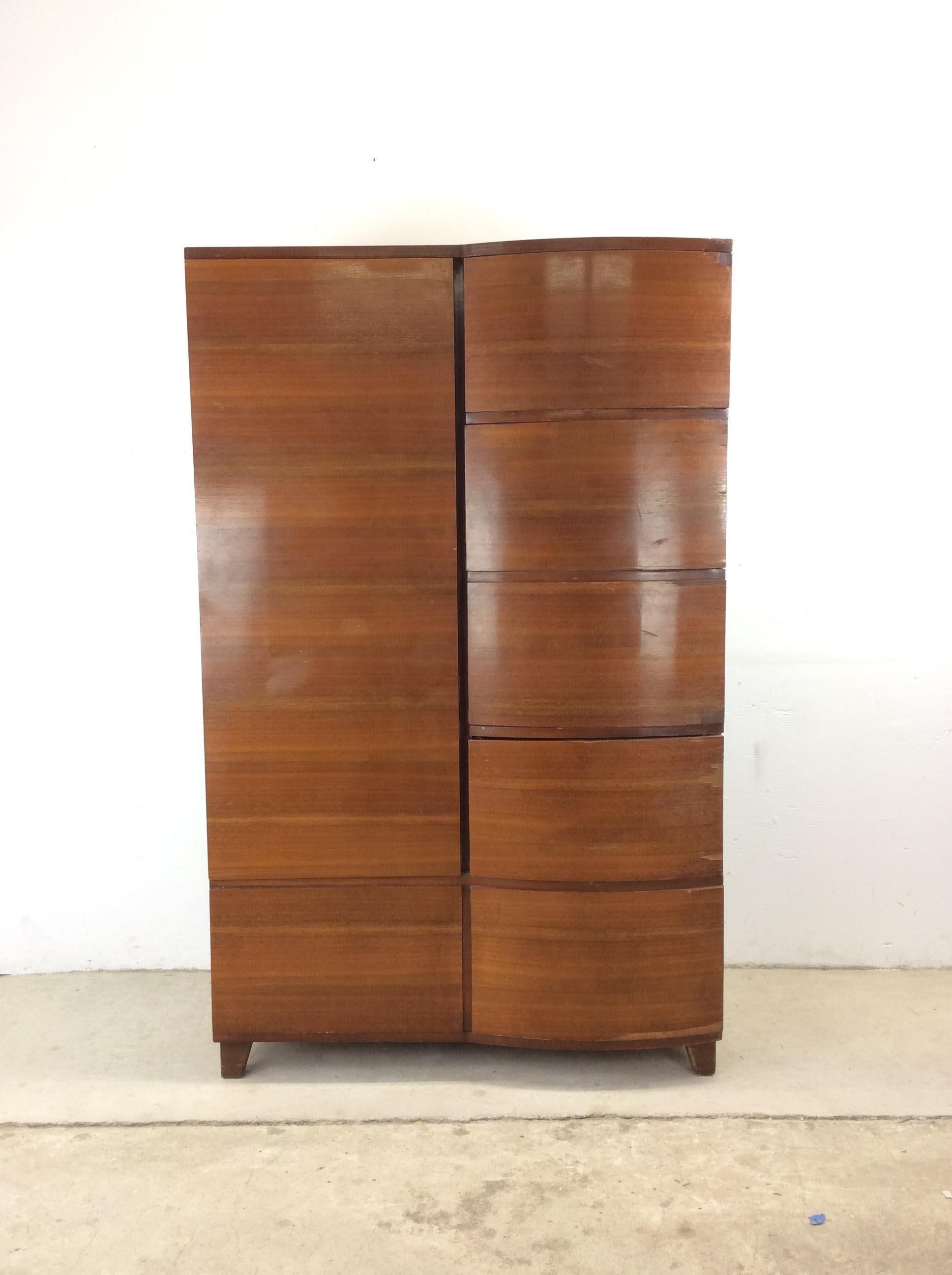 This Art Deco armoire features cedar lined wardrobe cabinet for hanging clothes and four dovetailed drawers with bentwood drawer faces.

Matching nightstands and three drawer chest available separately. 

Dimensions: 38w 21d 61h

Condition: Original