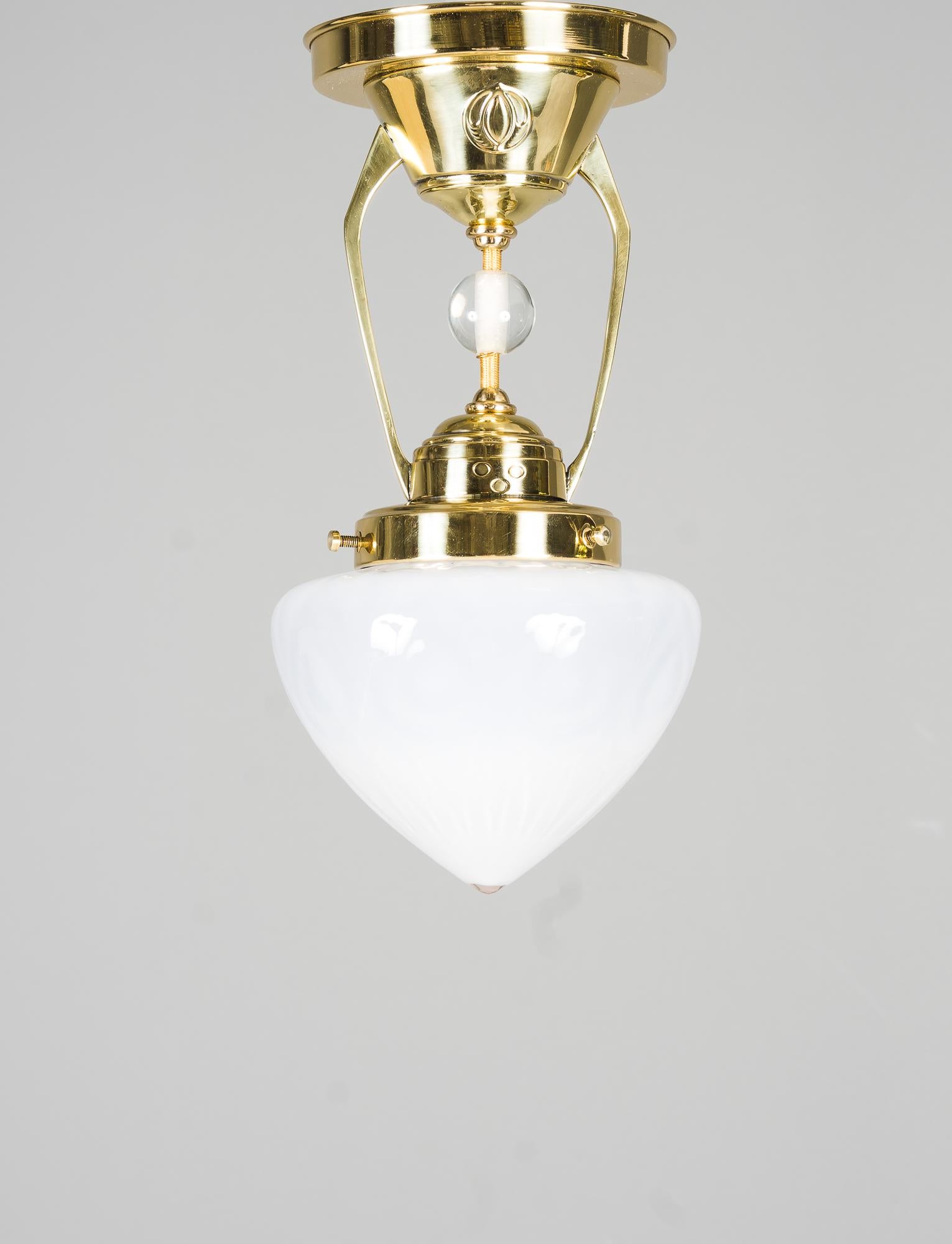 Art Deco ceiling lamp around 1920s
Polished and stove enamelled
Original opaline glass shade.