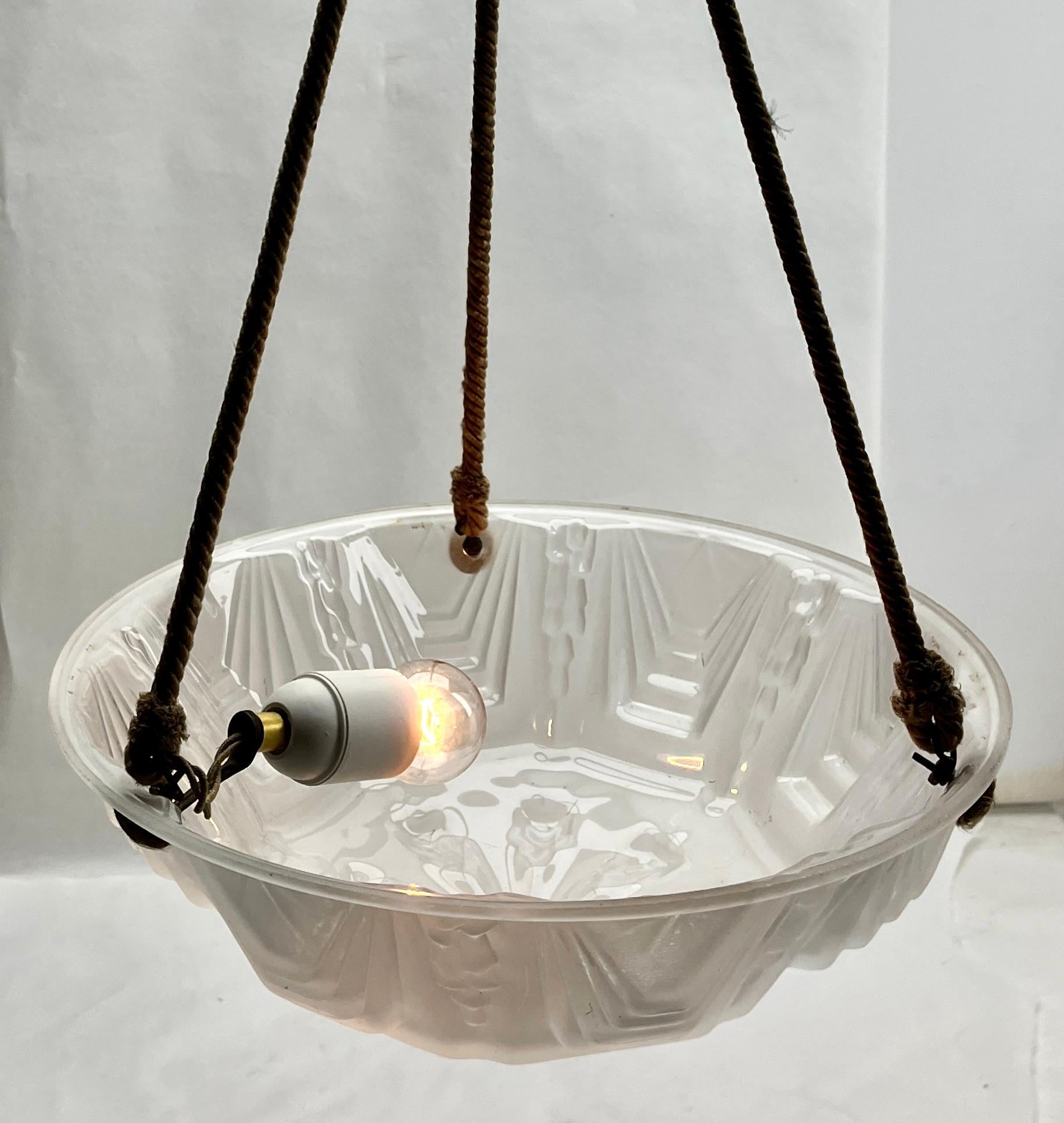 Art Deco French Ceiling lamp

Photography fails to capture the simple elegant illumination provided by this lamp.

Pendant Ceiling light with Chain to hold a stylish French Art Deco lampshade. 
Good distribution of darker and lighter shades, 
A
