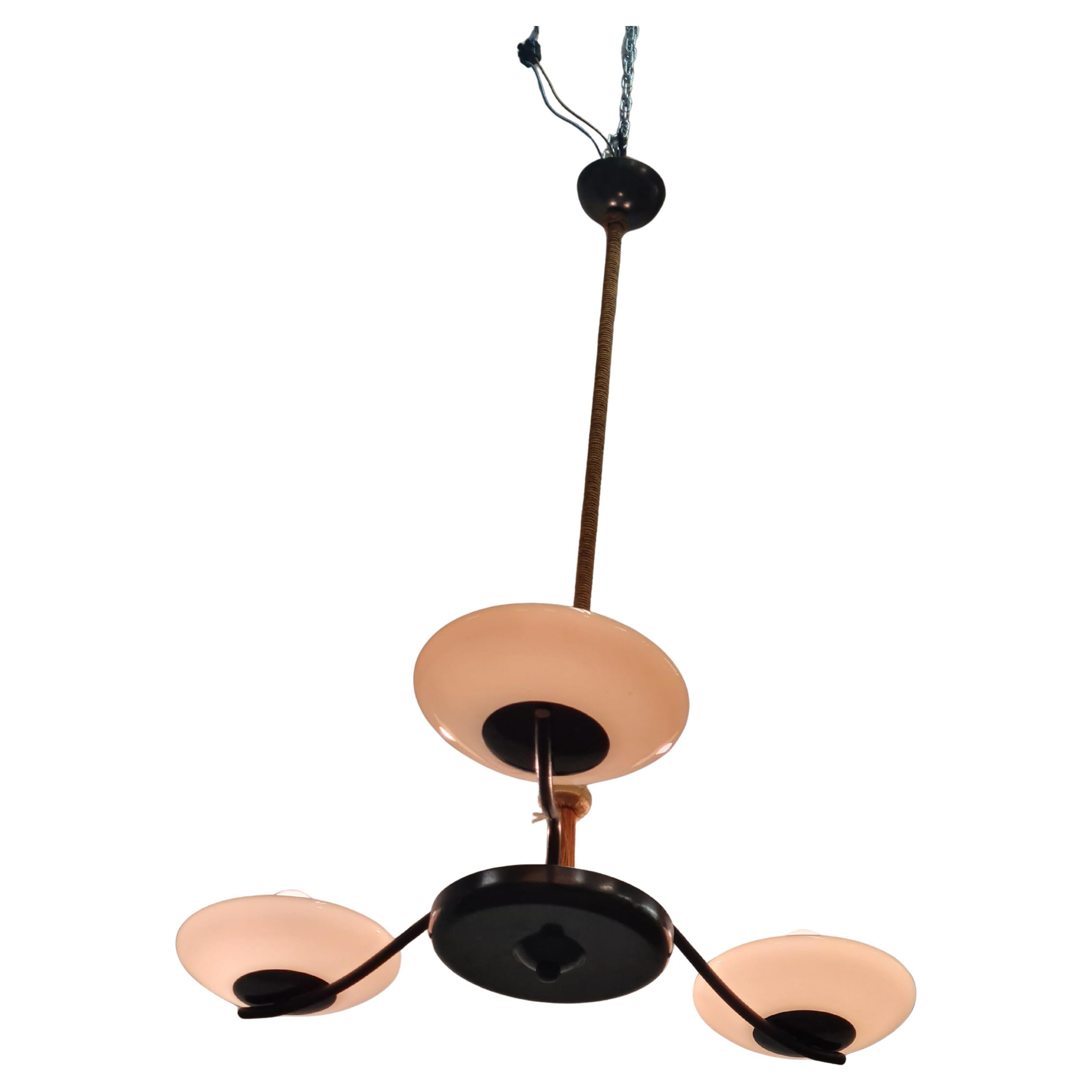 A beautiful art deco ceiling lamp in patinated brass, string decoration and blown glass shades. The lamp is almost certainly by Paavo Tynell and manufactured by Taito as many quite similar examples with slight variations can be found in a couple of