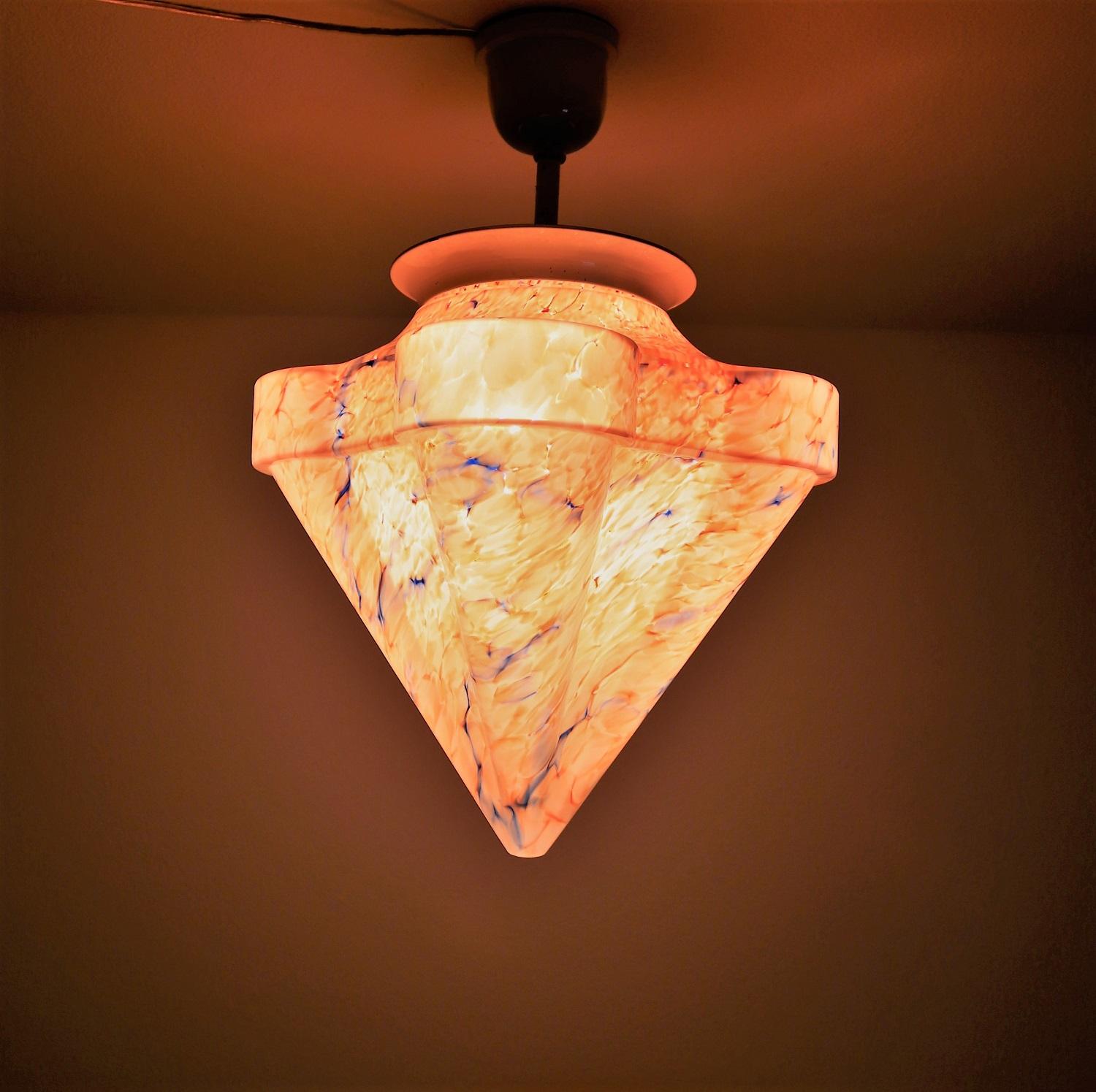 Beautiful ceiling lamp or flush mount lighting with gorgeous heavy and strong glass in orange - blue - white color.
Made in Italy beginning of the 20th century (circa 1930)
The glass leaves a light orange color to the room when illuminated.
The