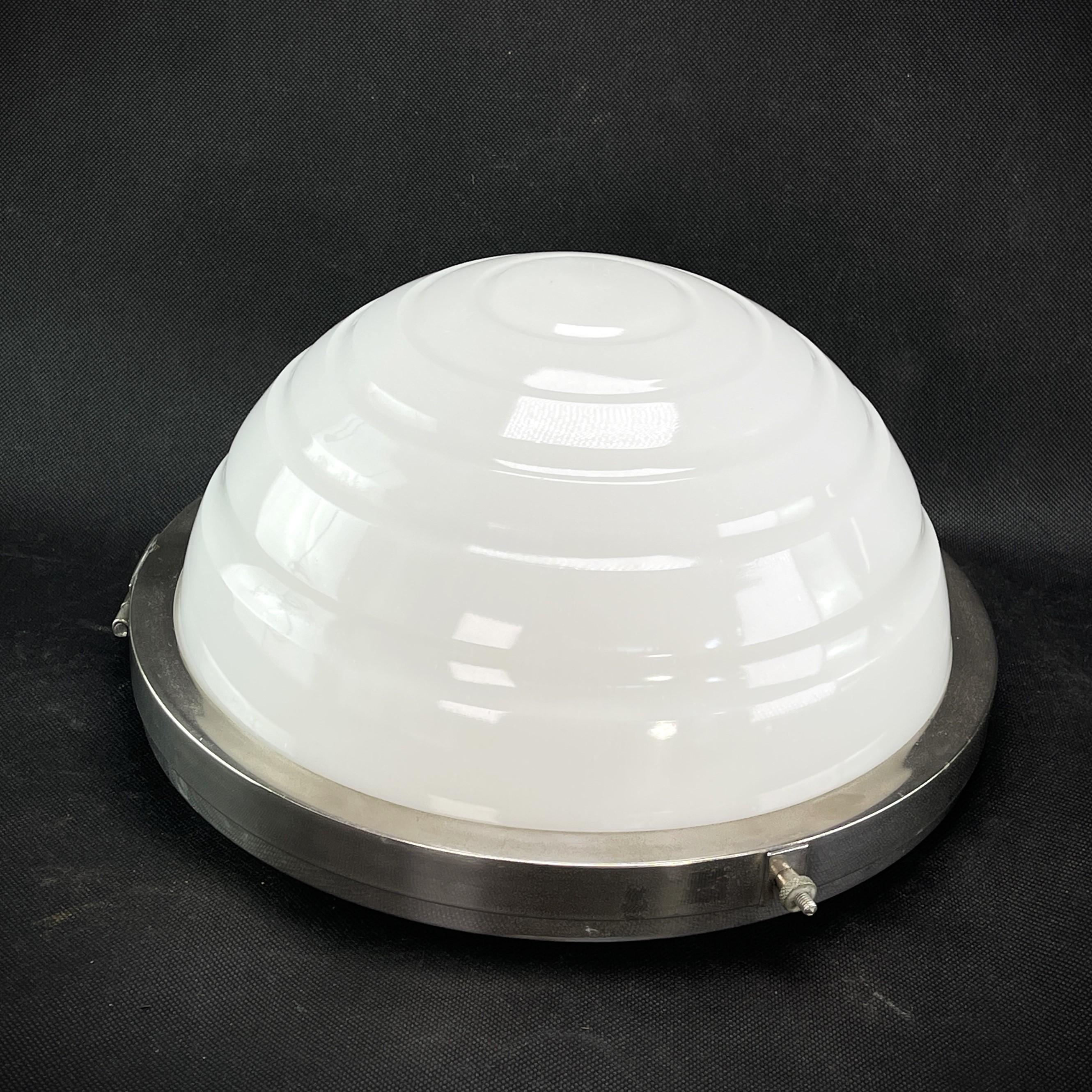 Art Deco ceiling or wall light -1930s

This rare, original ceiling lamp captivates with its simple and matter-of-fact Art Deco design. The lamp gives a very pleasant light. This ceiling lamp is an absolute design classic from the ART DECOS