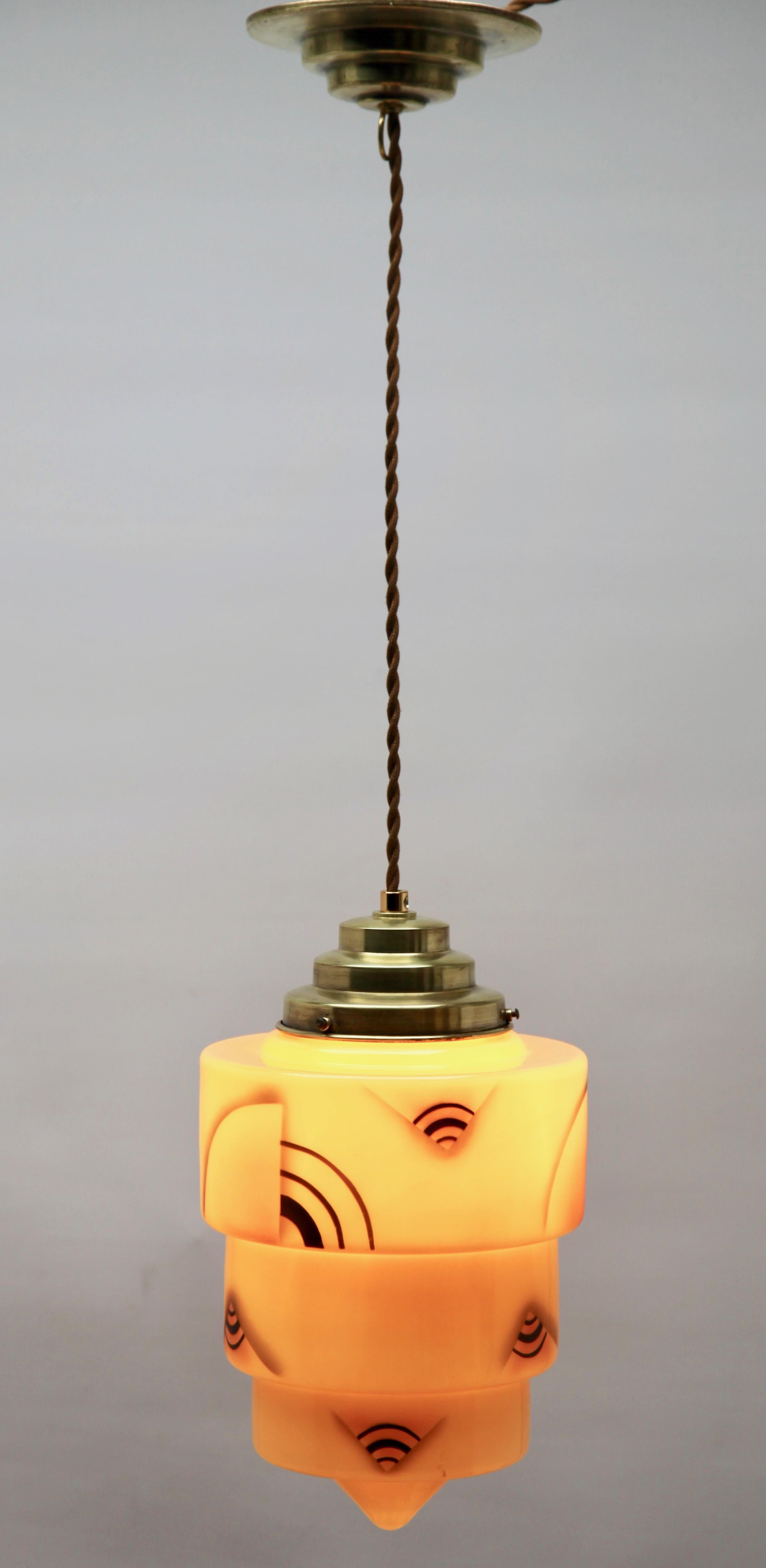 Art Deco ceiling lamp

Photography fails to capture the simple elegant illumination provided by this lamp.

Fitting messing pendant ceiling light with screw fixing to hold a stylish Belgian Art Deco lampshade. Good distribution of darker and