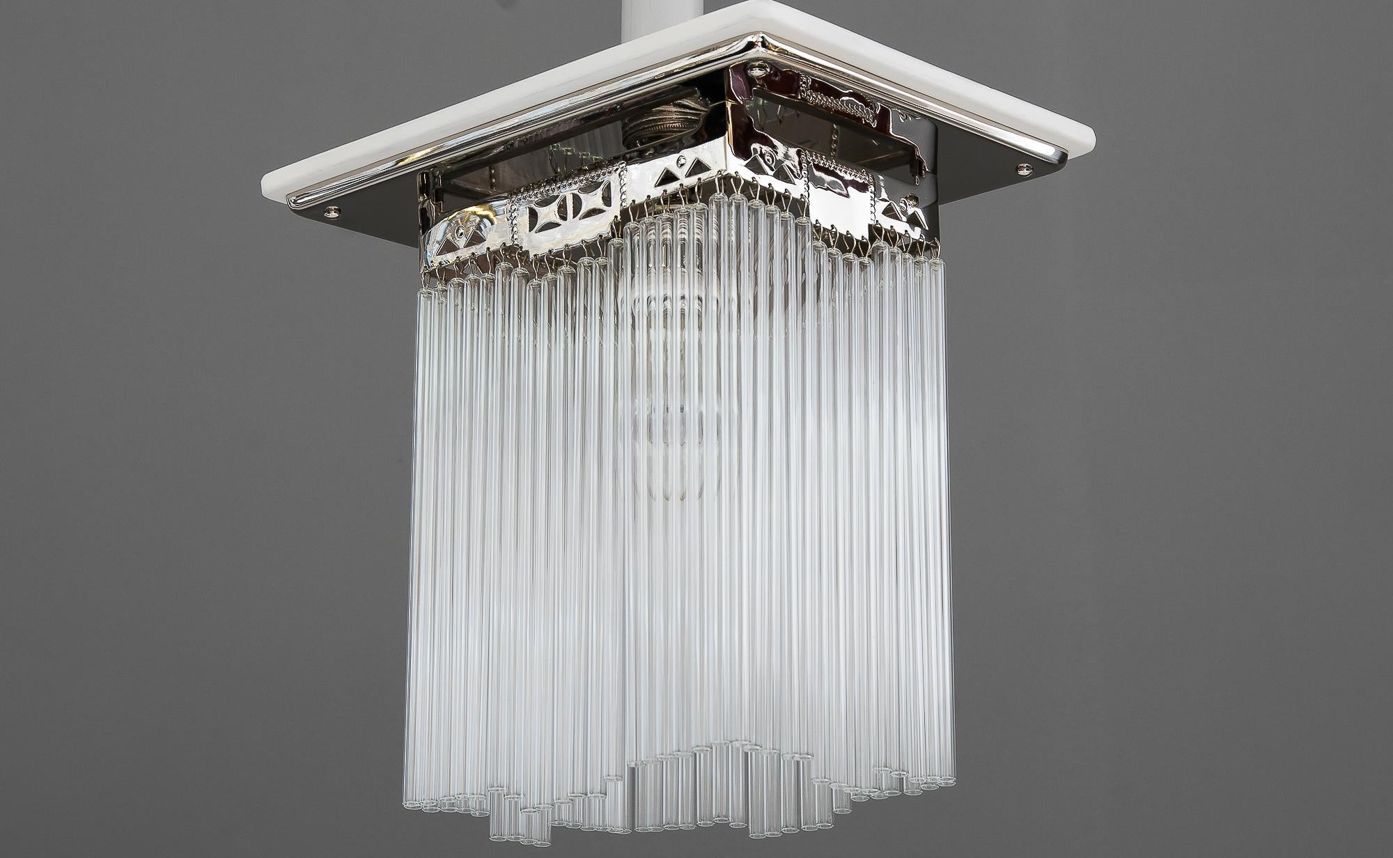 Art Deco ceiling lamp Vienna circa 1920s with white painted wood plate
Glass sticks are replaced (new).