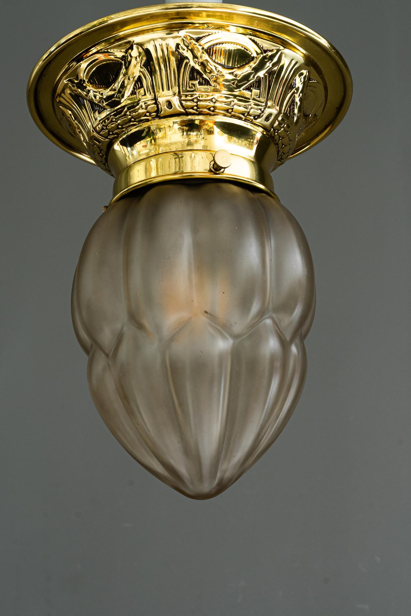 Art Deco ceiling lamp vienna around 1920s
Brass polished and stove enameled
Original antique glass shade