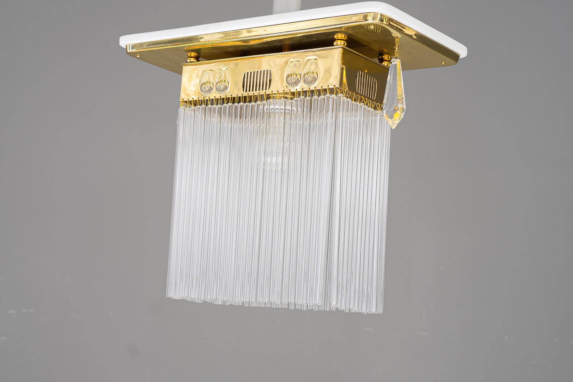 Art Deco ceiling lamp with glass sticks vienna around 1920s
Brass polished and stove enameled
Wood on top white painted
The glass sticks in the middle are replaced ( new )
