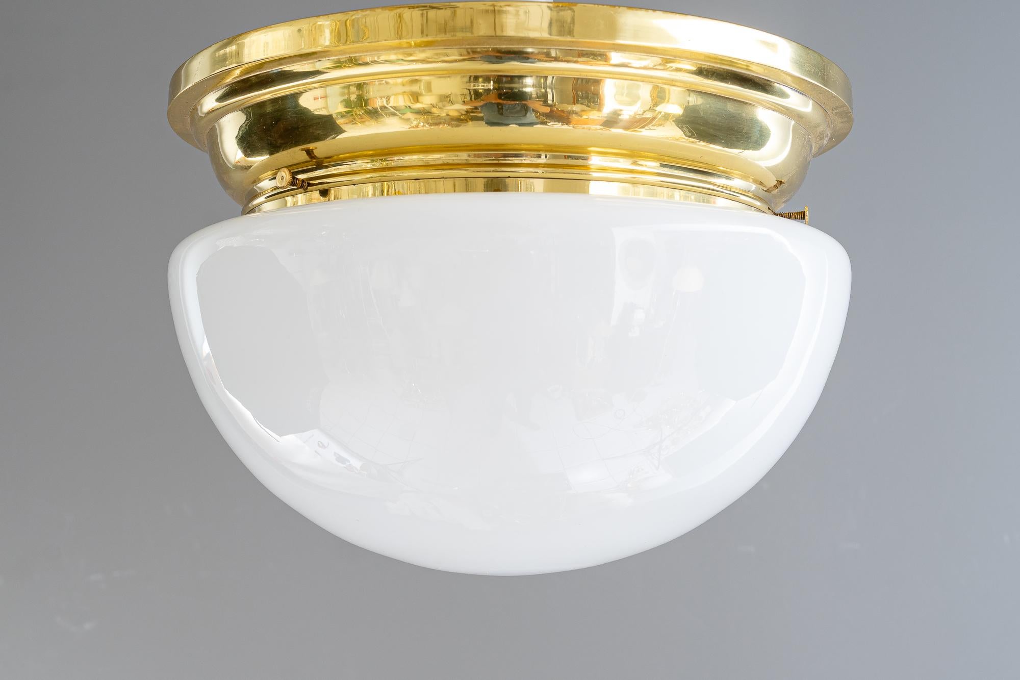 Art Deco ceiling lamp with opal glass shade vienna around 1920
Brass polished and stove enameled
Original opal glass shade