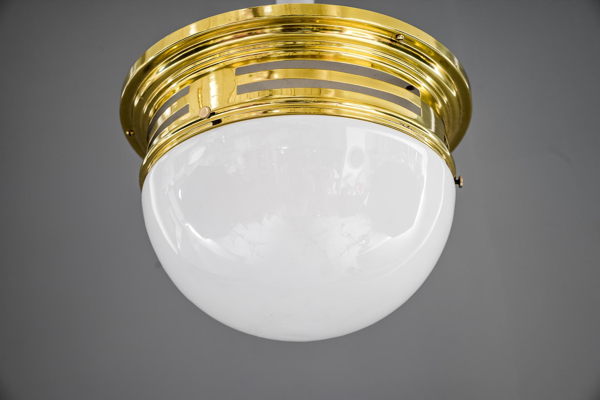 Art Deco ceiling lamp with opal glass Vienna around 1920s 
Brass polished and stove enamelled.
  