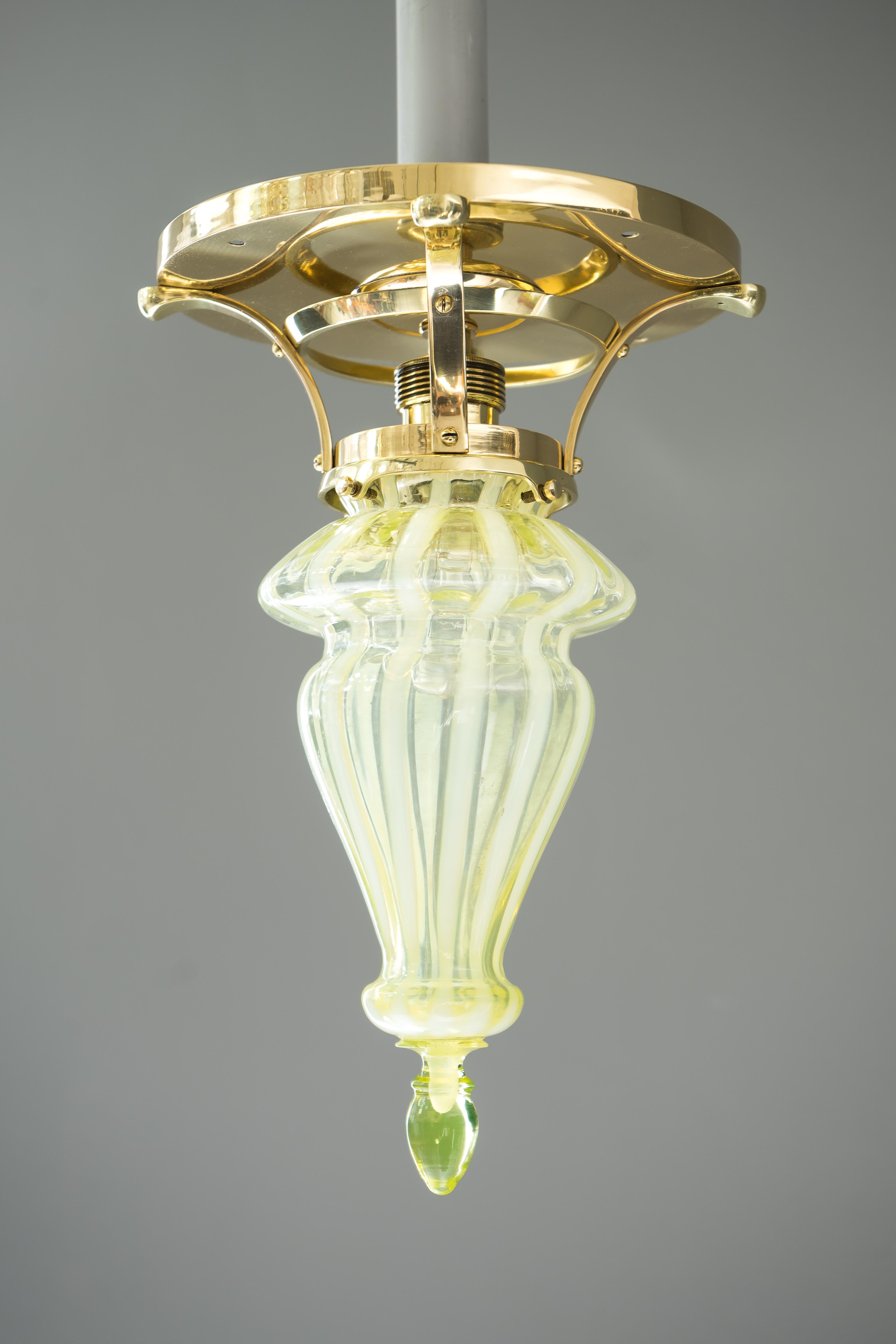 Art Deco ceiling lamp with Opaline glass shade, circa 1918.
Polished and stove enameled.