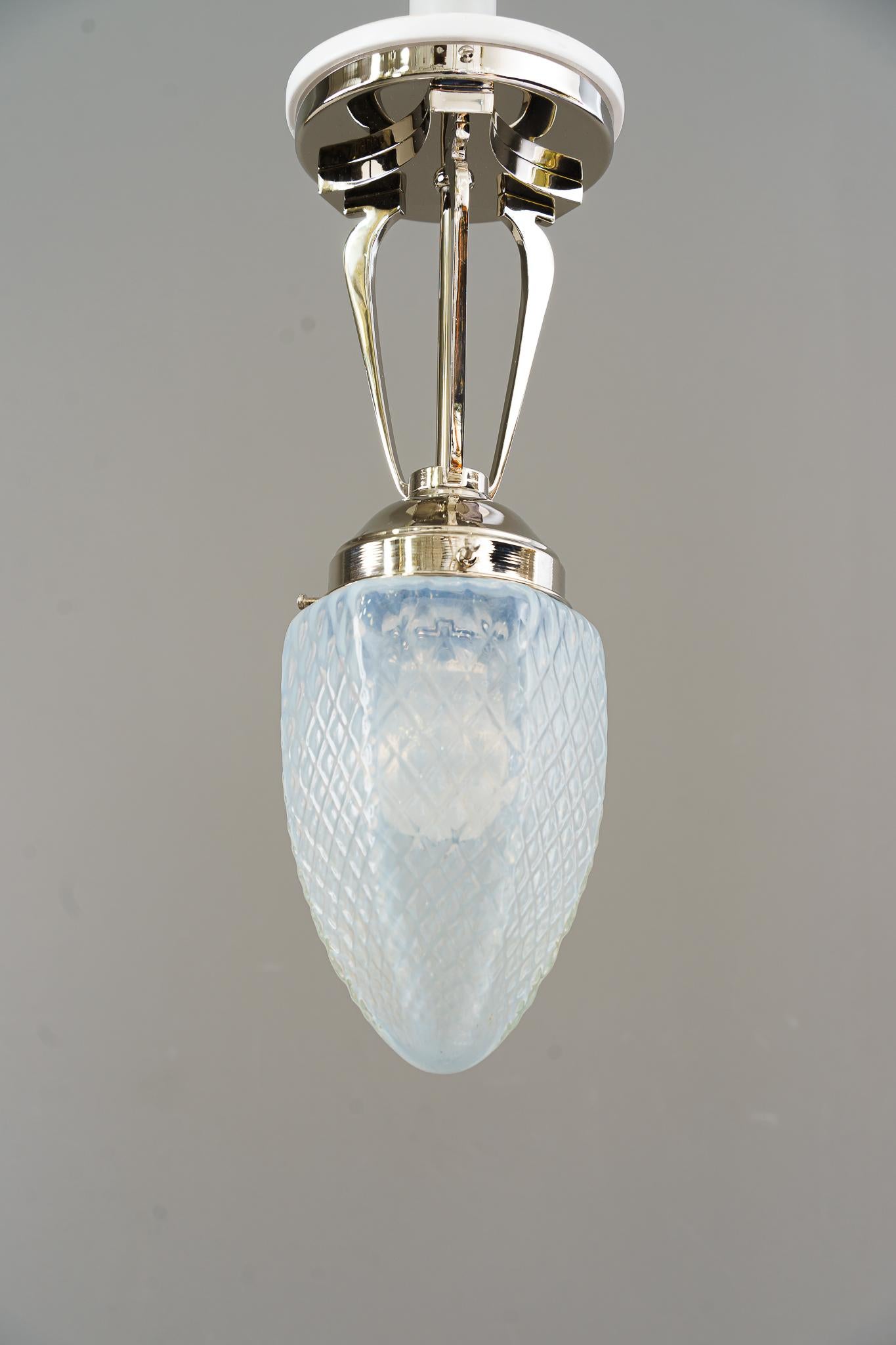 Art Deco ceiling lamp with opaline glass shade vienna around 1920s
Polished and stove enameled
Original opaline glass shade
Nickel - plated.