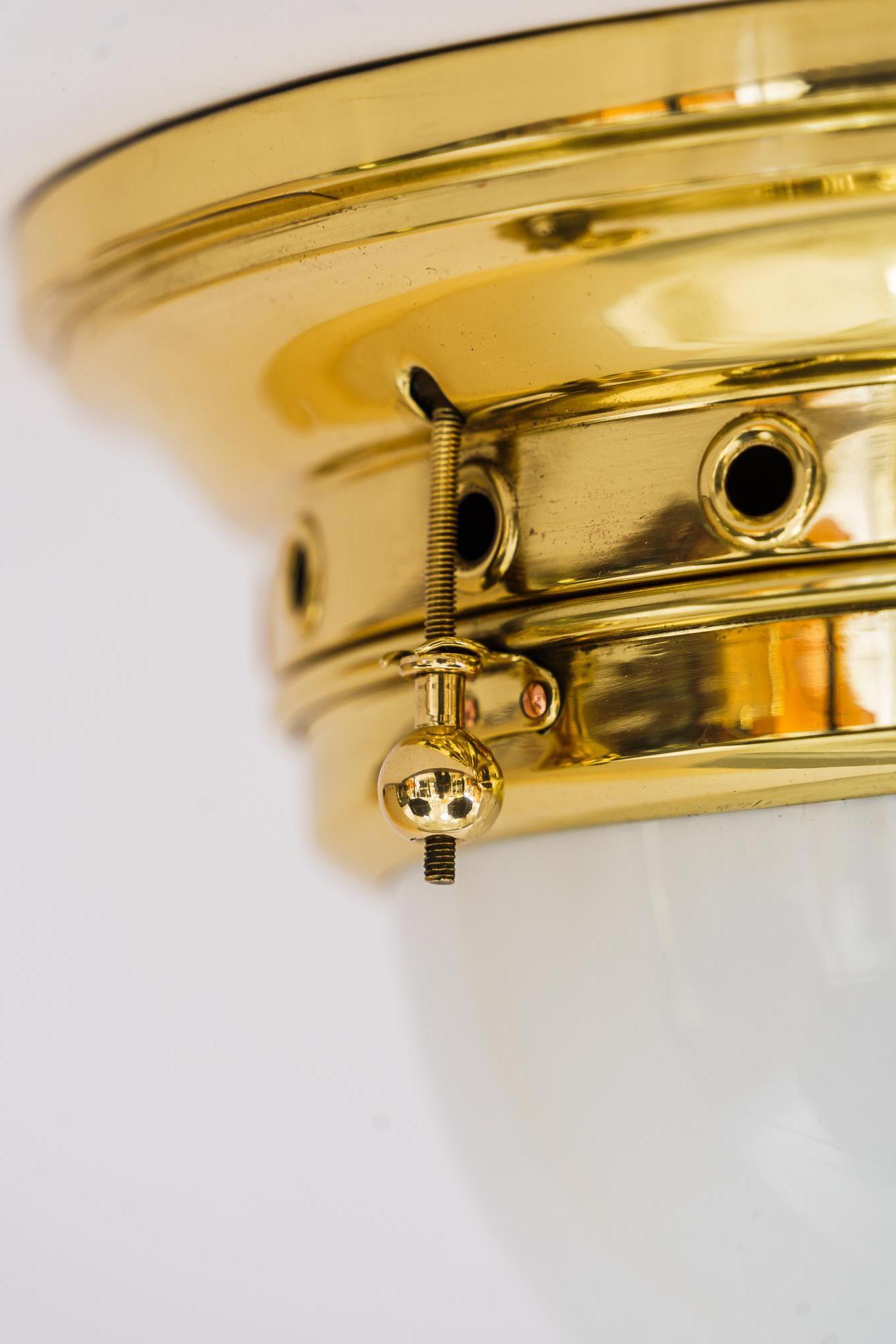 Art Deco ceiling lamp with original opal glass shade vienna circa 1920s
Brass polished and stove enameled.