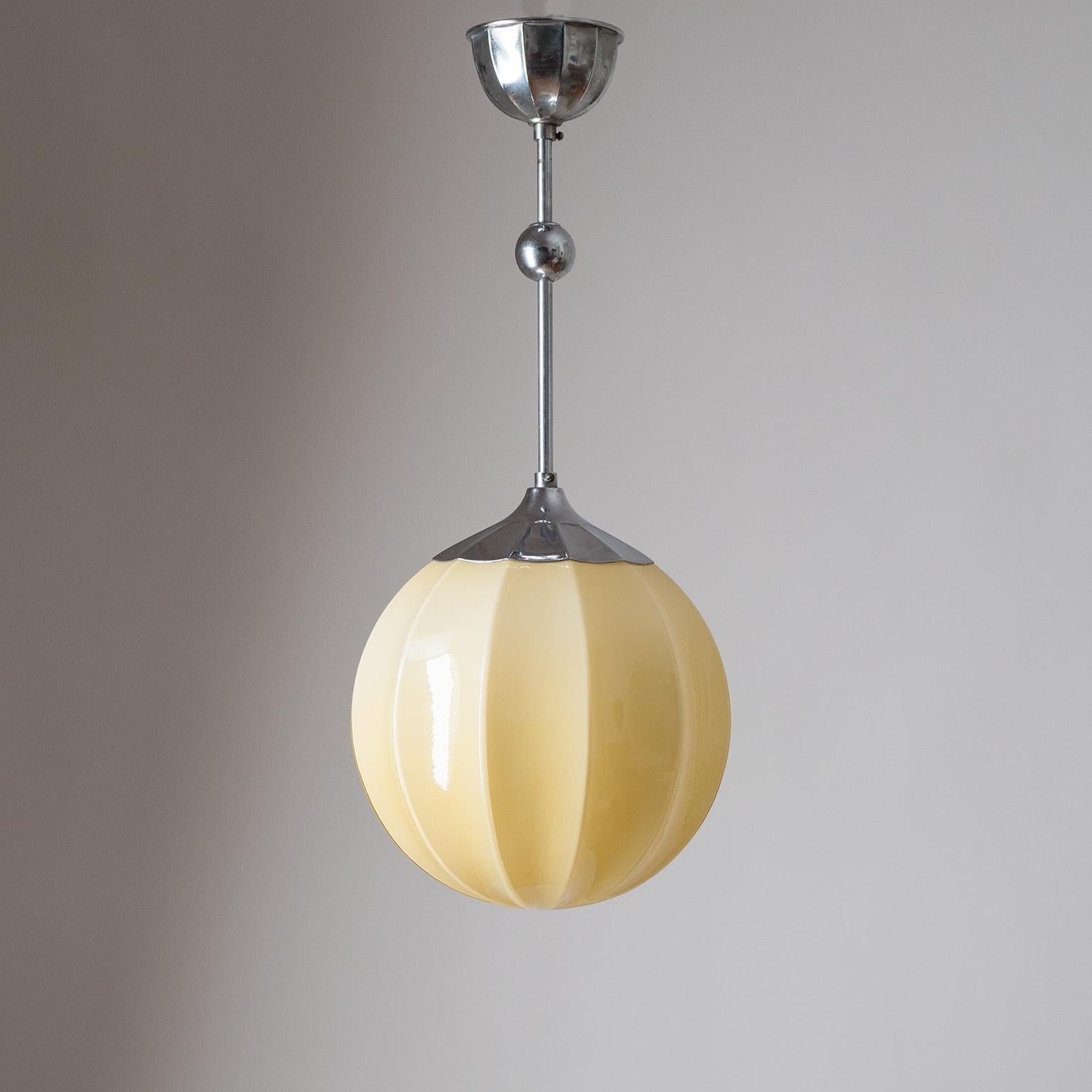 Fine Art Deco ceiling light, Germany, circa 1930. Sand-colored and balloon-shaped glass diffuser with chrome hardware. One original nickel and ceramic E27 socket with new wiring.
