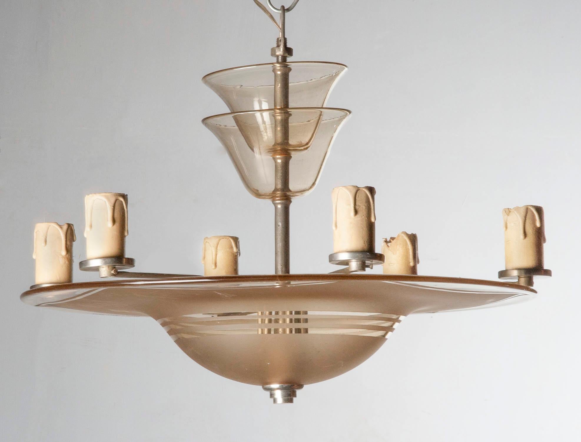 A French Art Deco ceiling lamp. Made in the end of the French Art Deco period, circa 1930-1940. It have a modernist appeal. The lamp have a frosted etched glass bowl. The base is an iron structure, on each end E17 fittings, with cardboard