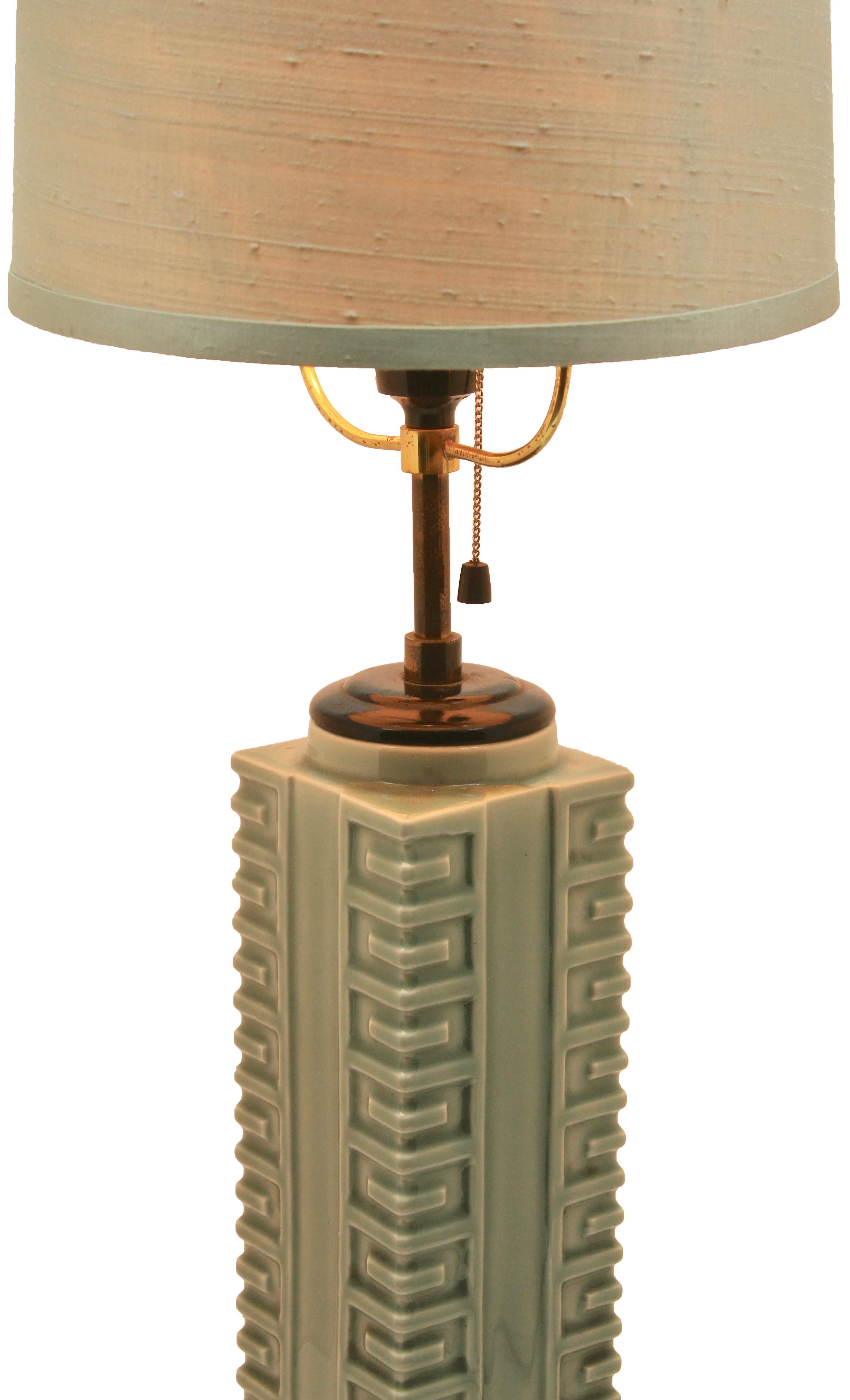 This geometric pedestal table-lamp might seem to reflect the styles that inspired Art deco, but it actually comes from a long-standing Chinese tradition. The glaze is celadon in a light jade colour, and the lamp bears the label of ??? and, although