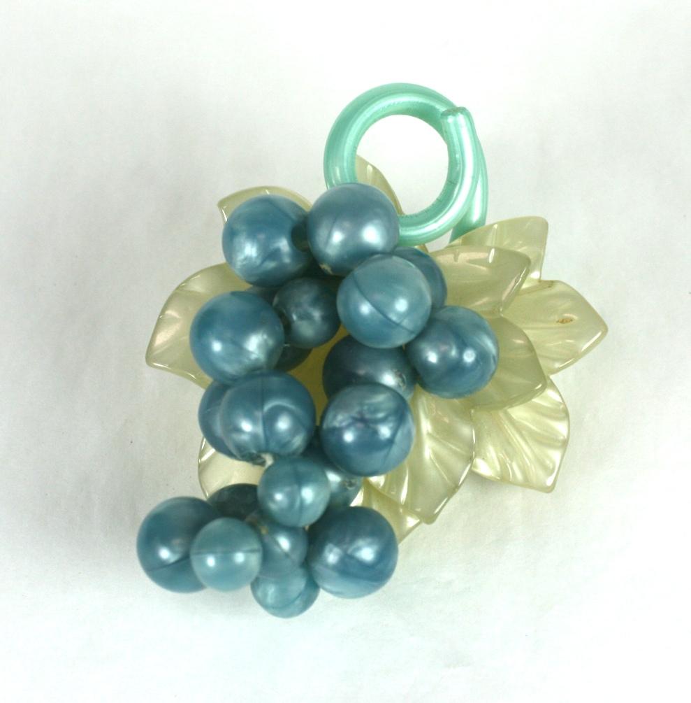 Large Art Deco Celluloid Grape Brooch from the 1930's. Pale blue and pearlized celluloid are carved and molded to form a large, 3 dimensional grape cluster. 
1930's USA.
Excellent condition. 