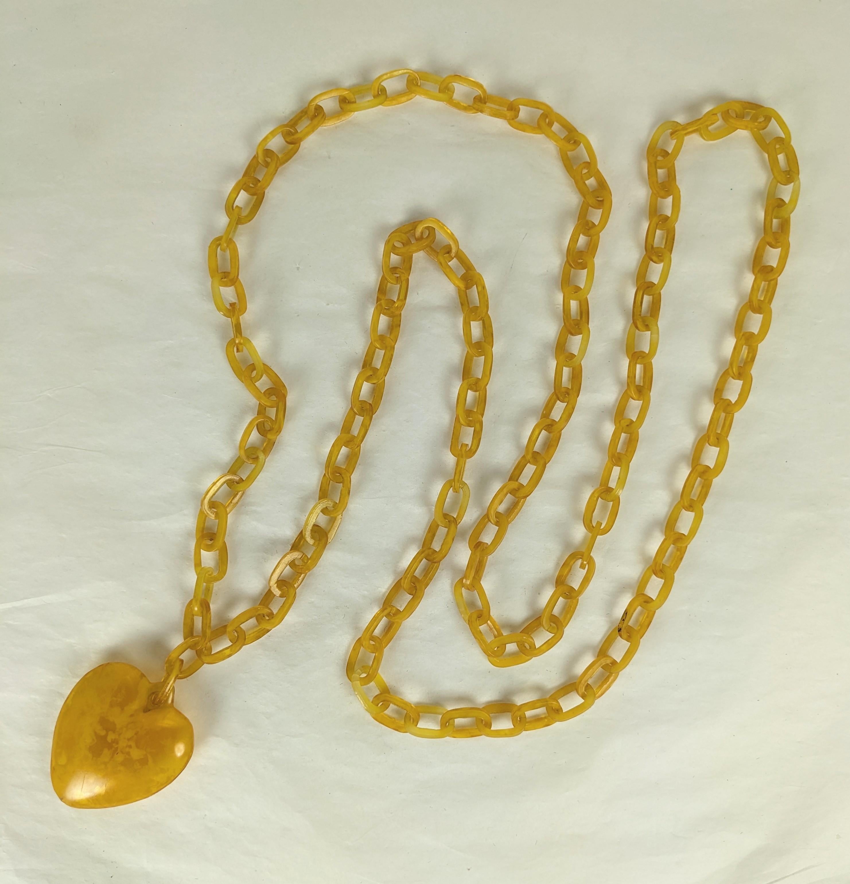 Art Deco Celluloid Heart Chain from the 1920's. Unusual caramel celluloid puffy hollow heart with super long original chain perfect for doubling up around neck. 54
