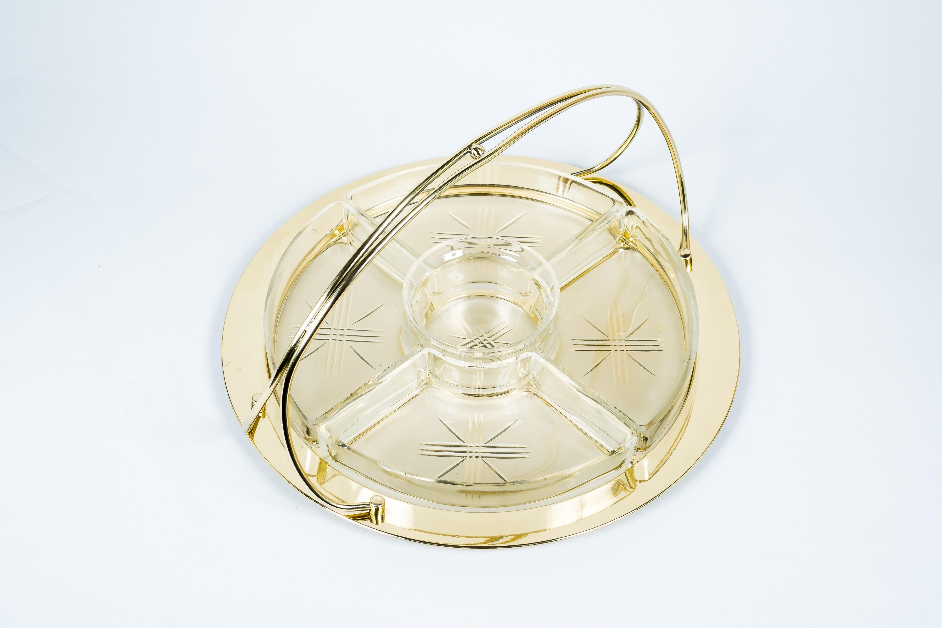 Art Deco centerpiece cut glass and brass execution around 1920s
Brass polished and stove enameled.