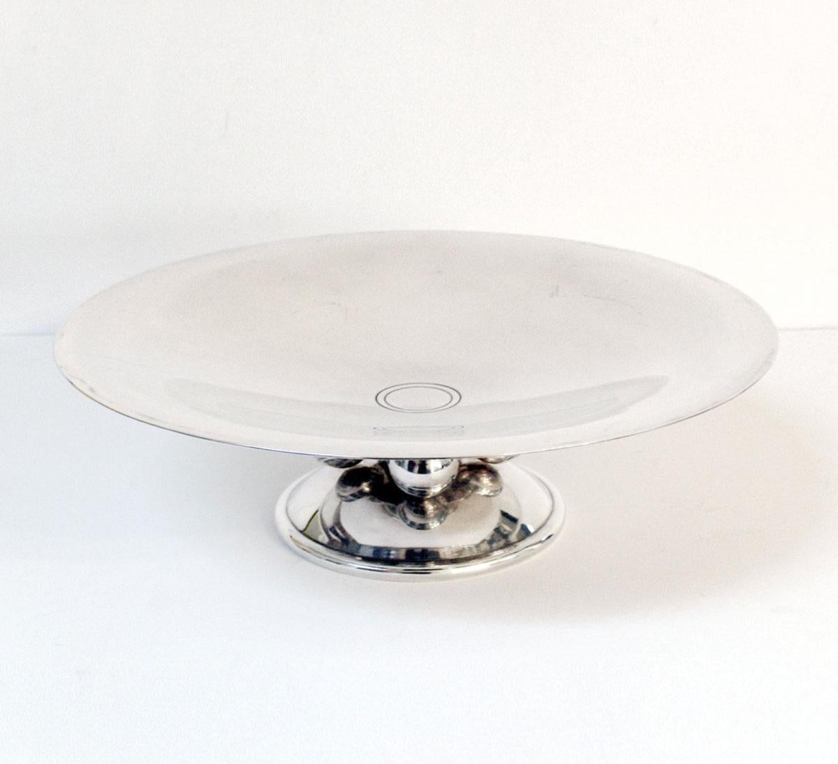 Iconic large Art Deco style fruit bowl or centerpiece created by for the famous silversmith Christofle for the 'Normandie' ocean liner. Circular shape with a round base decorated with four spheres. 
Piece stamped beneath with Christophe hallmarks
