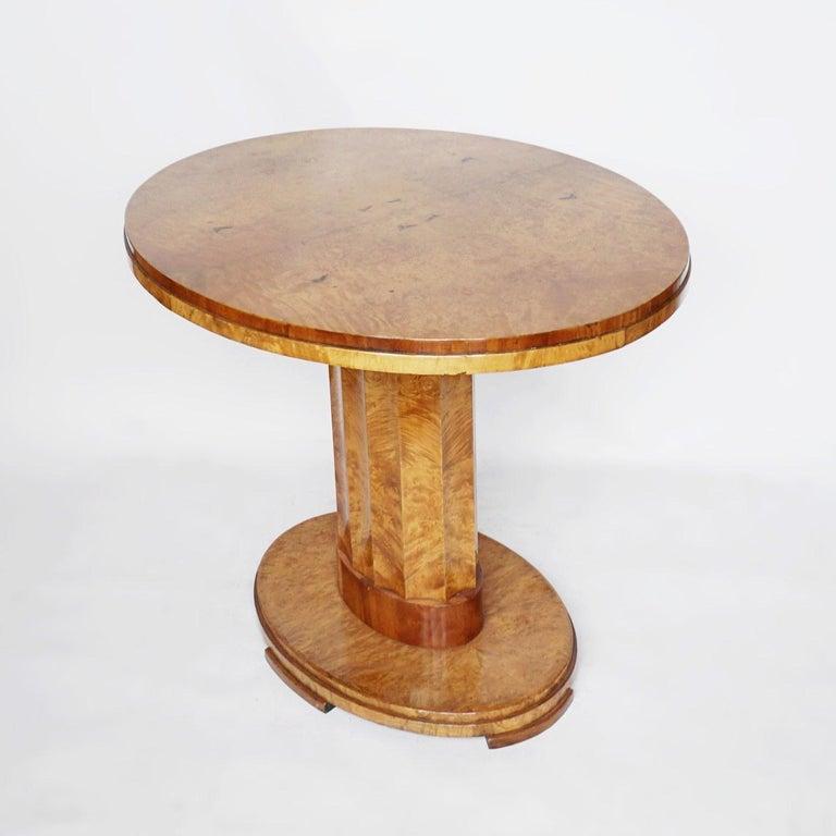 Art Deco centre table by Harry & Lou Epstein. Veneered walnut oval tables with fluted central columns and oval, stepped bases. Elm Banding to bottom of stem. 

Dimensions: H 75cm W 91cm D 73cm

Origin: English

Date: Circa 1935

Item No: