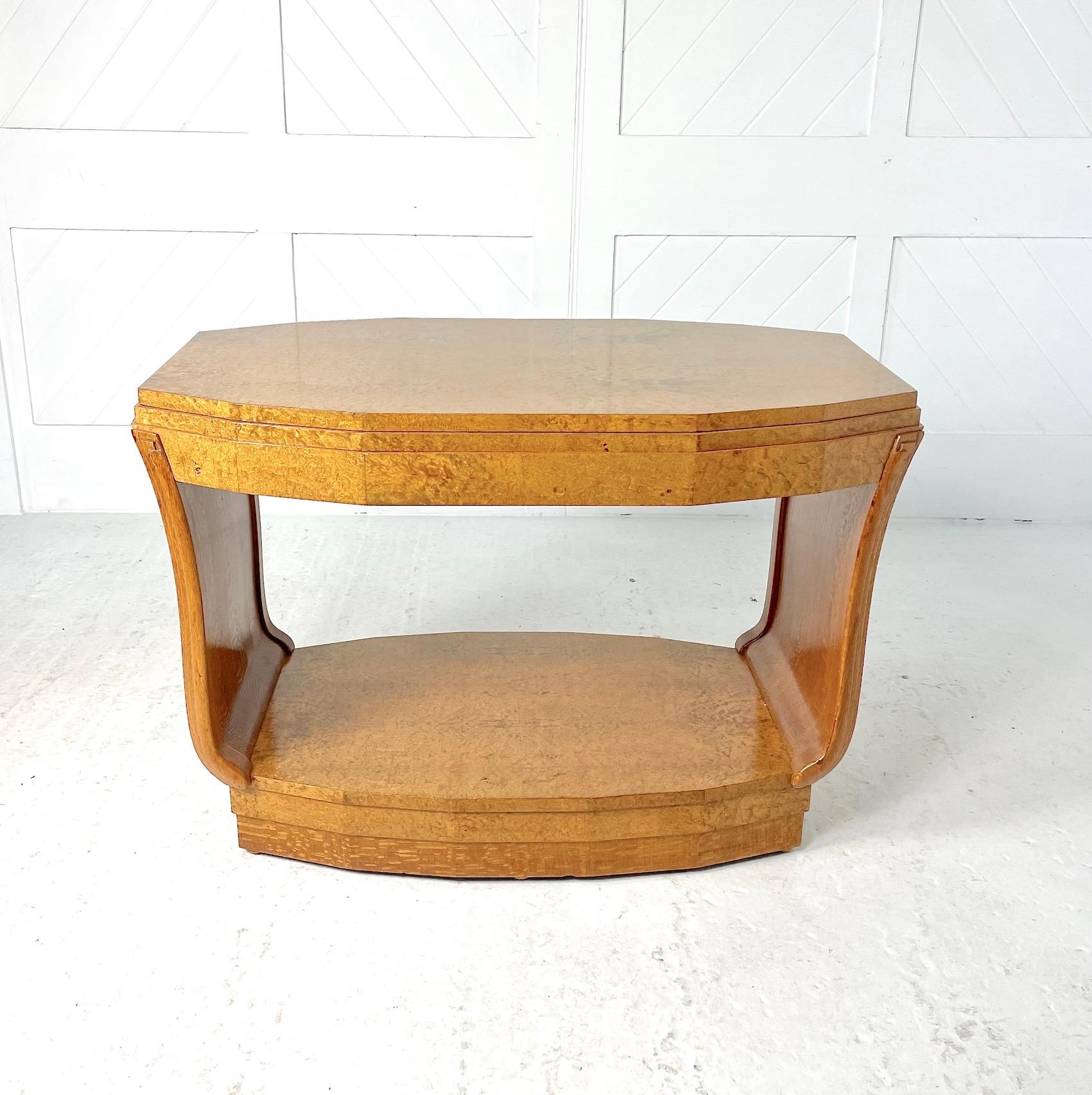 Art Deco  centre table

Constructed using silky oak for the sides and plinth.   The table top, base and fascia are made from highly figured pollard oak, with curving fluted sides and a stepped design to the top and plinth.

Attributed to Serge