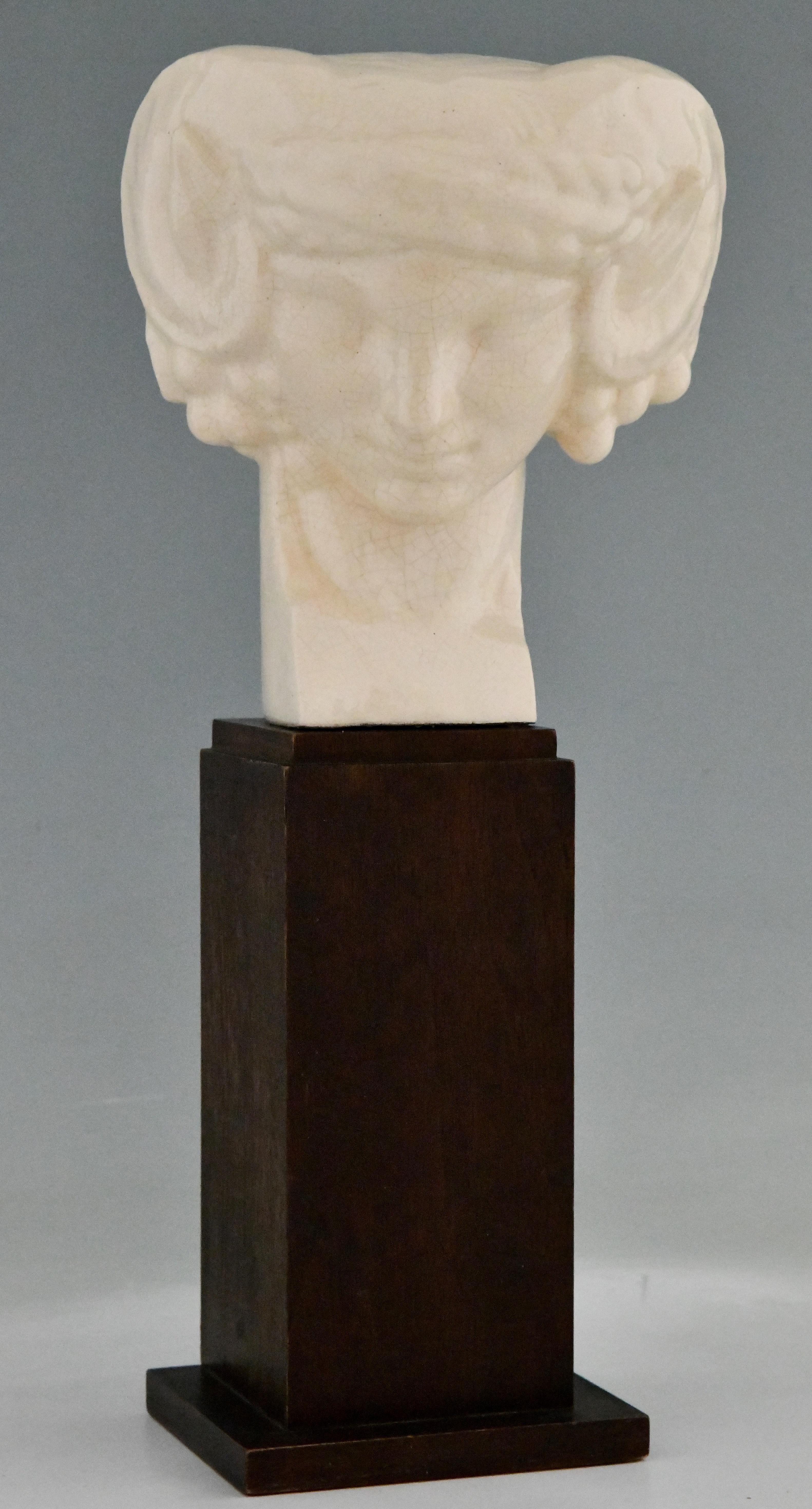 Art Deco ceramic craquelé bust of a faun signed by S. Foucault. On a wooden base. France 1925. Siméon Charles Joseph Foucault, known as Siméon Foucault (born May 3, 1884 in Nantes - died August 26, 1923 in Paris) was a French sculptor, he was