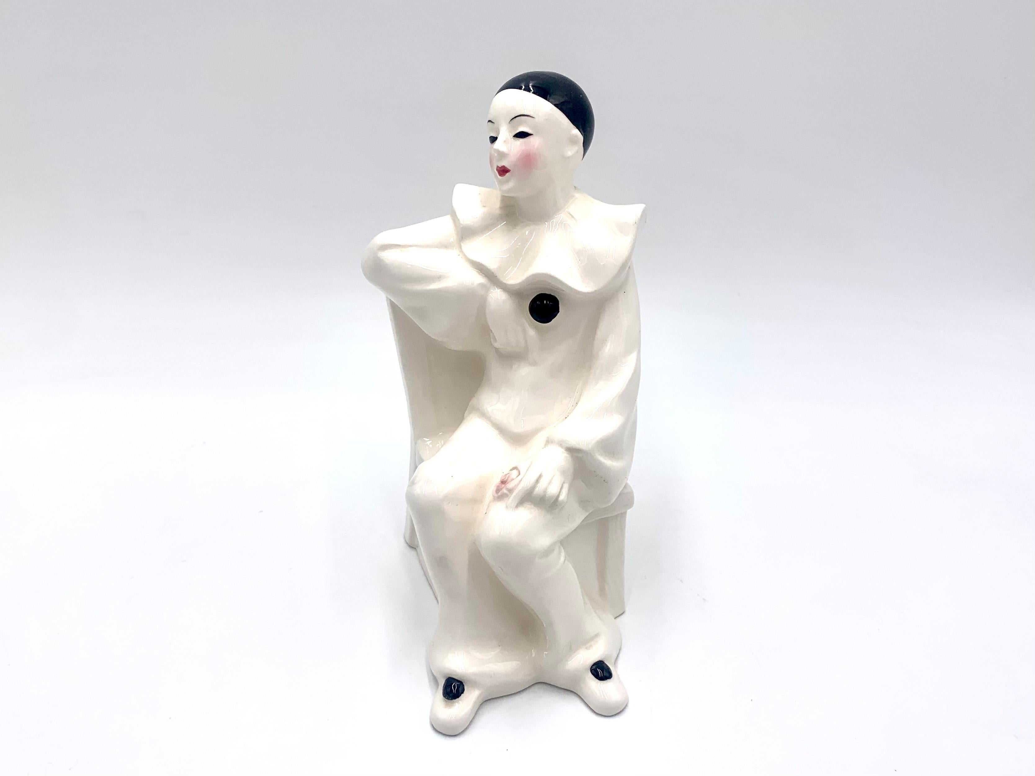 Ceramic Harlequin figurine. Not signed. Probably produced in Germany at the turn of the 1970s and 1980s. XX century. The figurine is in perfect condition.

Measures: height: 17cm; width 11cm; depth 6cm.